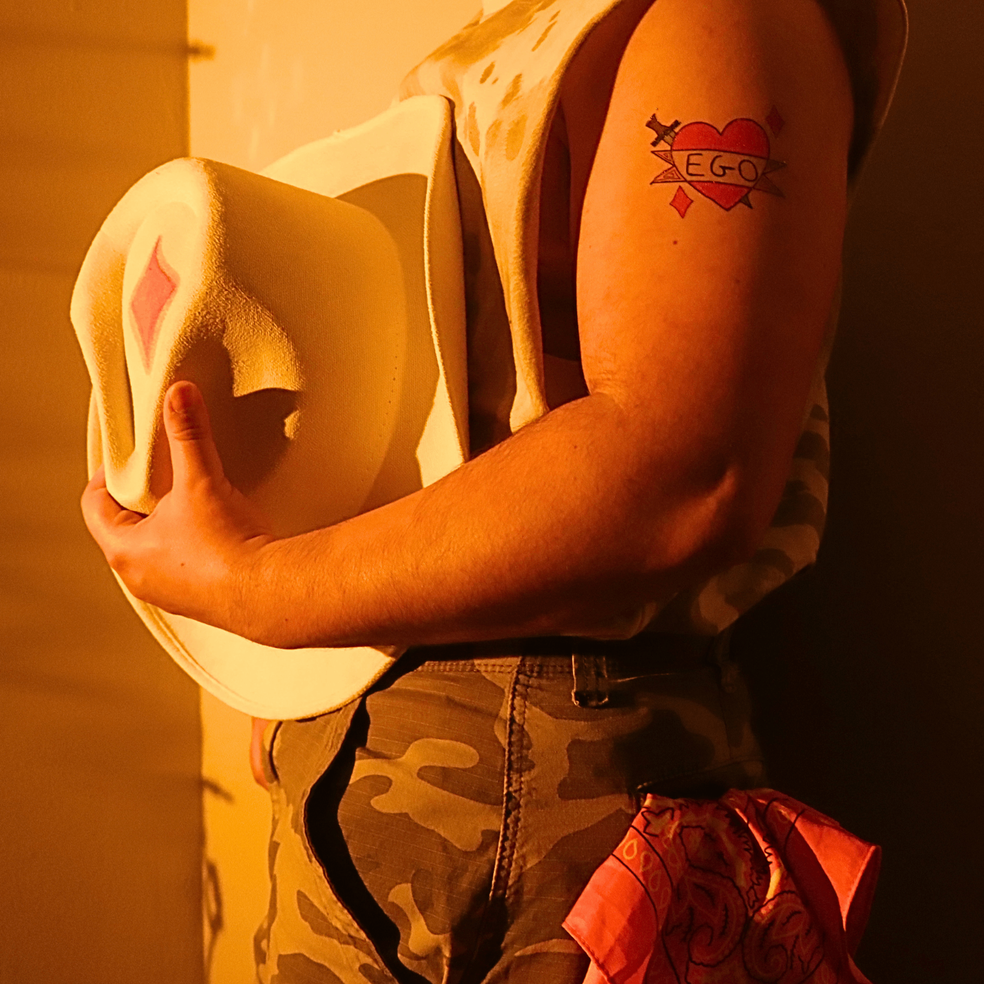 a man holding a hat