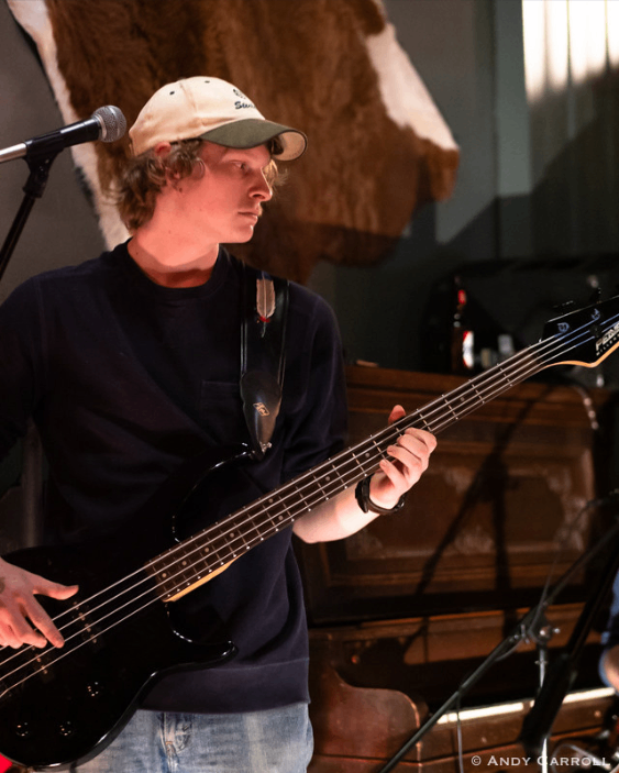 a man playing a bass