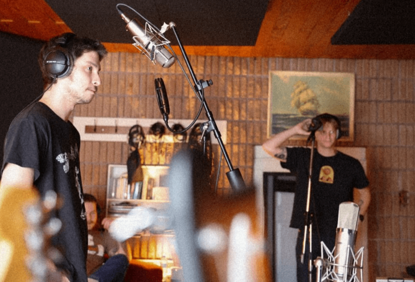a group of people in a recording studio
