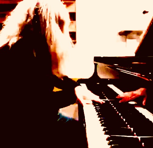 a woman is playing a piano