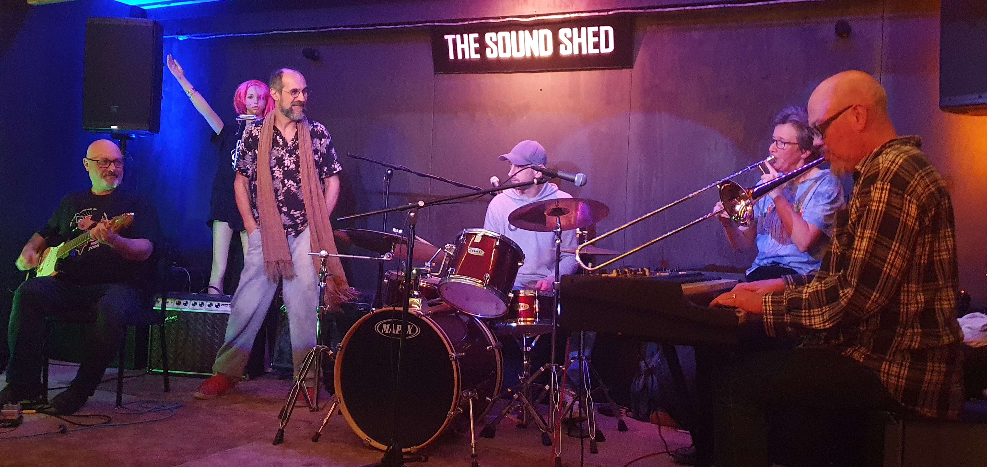a group of people playing music in a room