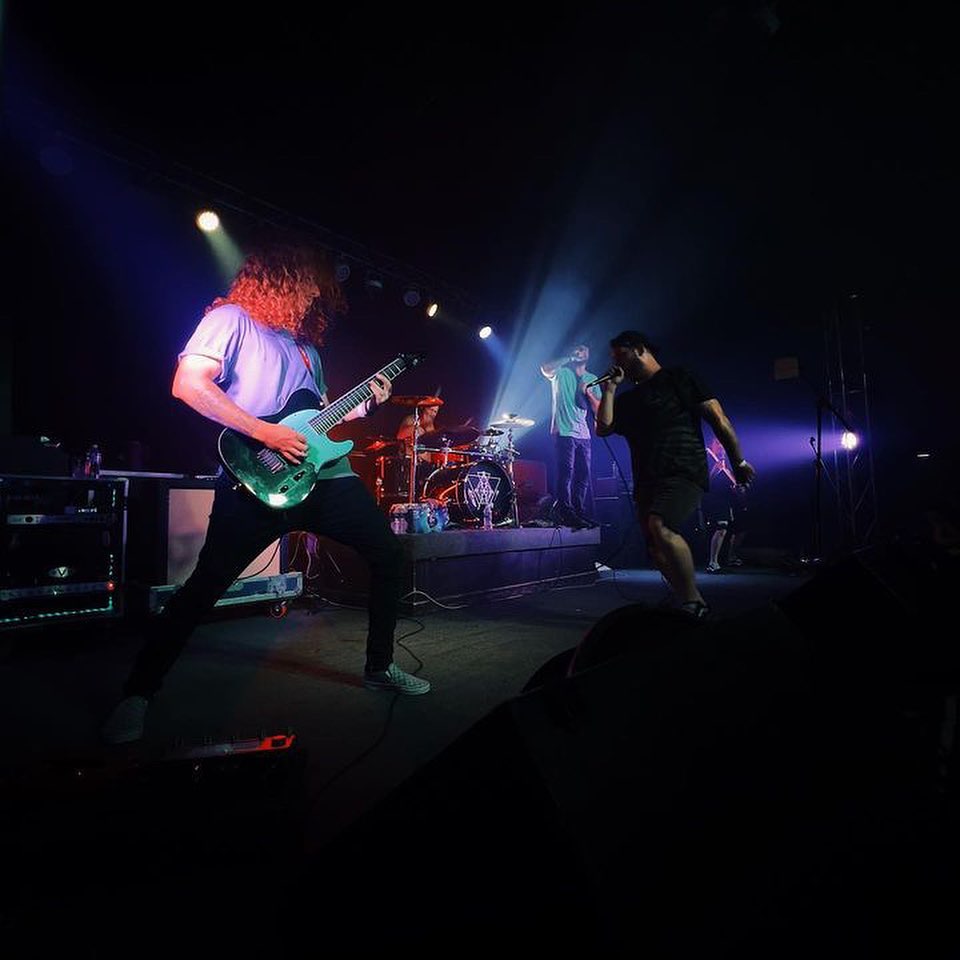 a group of people on stage at a concert