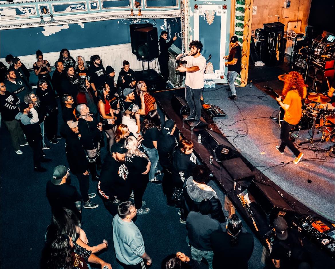 a group of people on stage at a concert