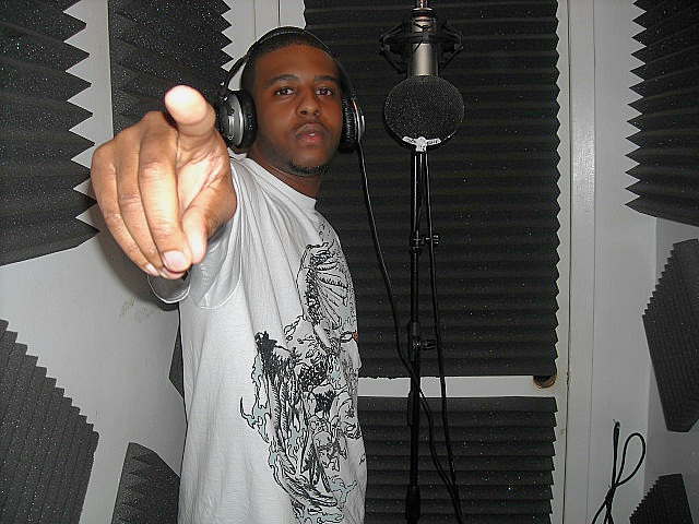 a man wearing headphones in a recording studio