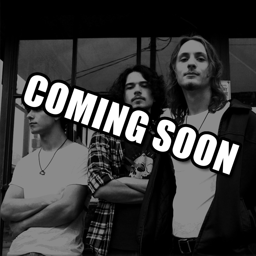 a black and white photo of a group of men standing in front of a store