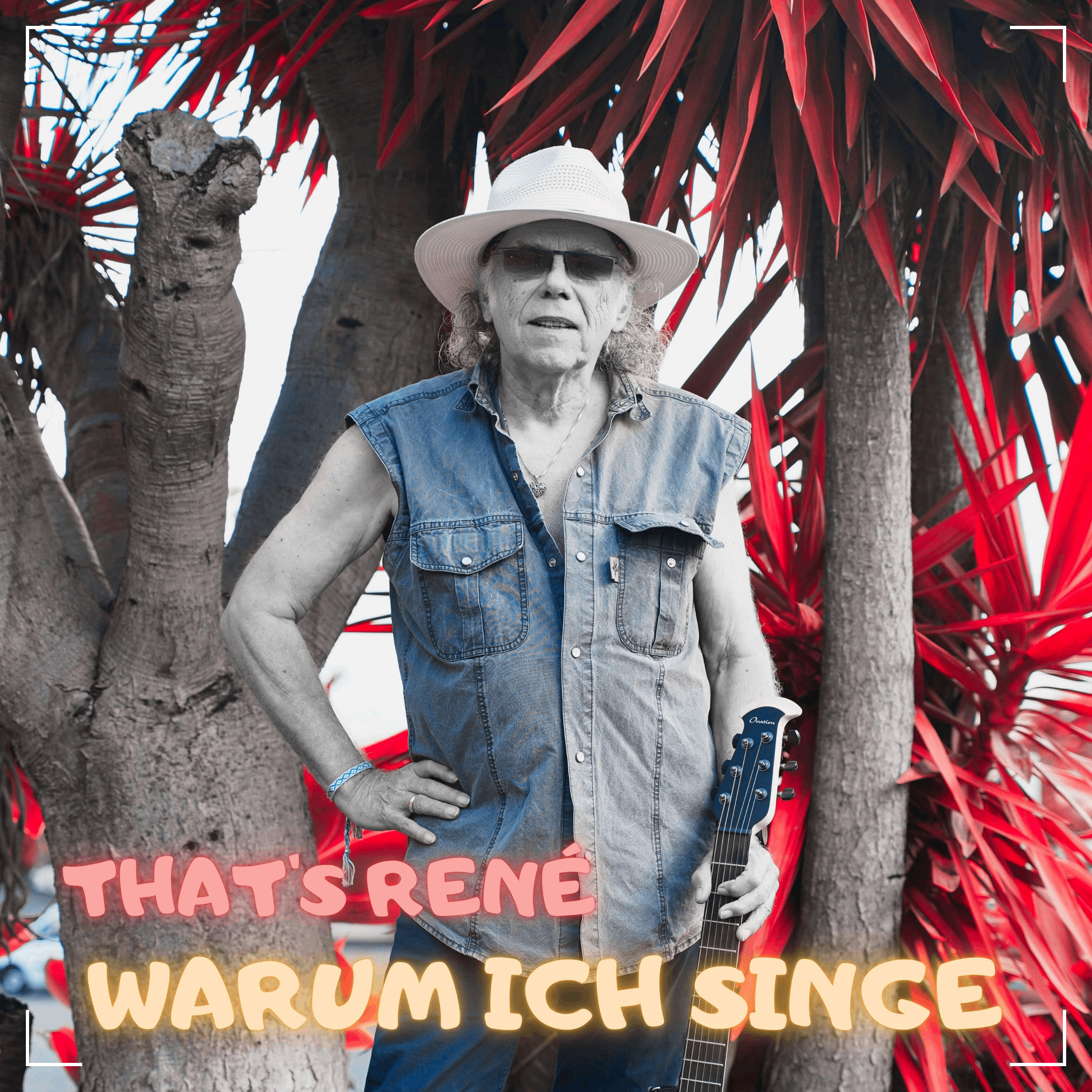 a man in a hat is standing next to a tree