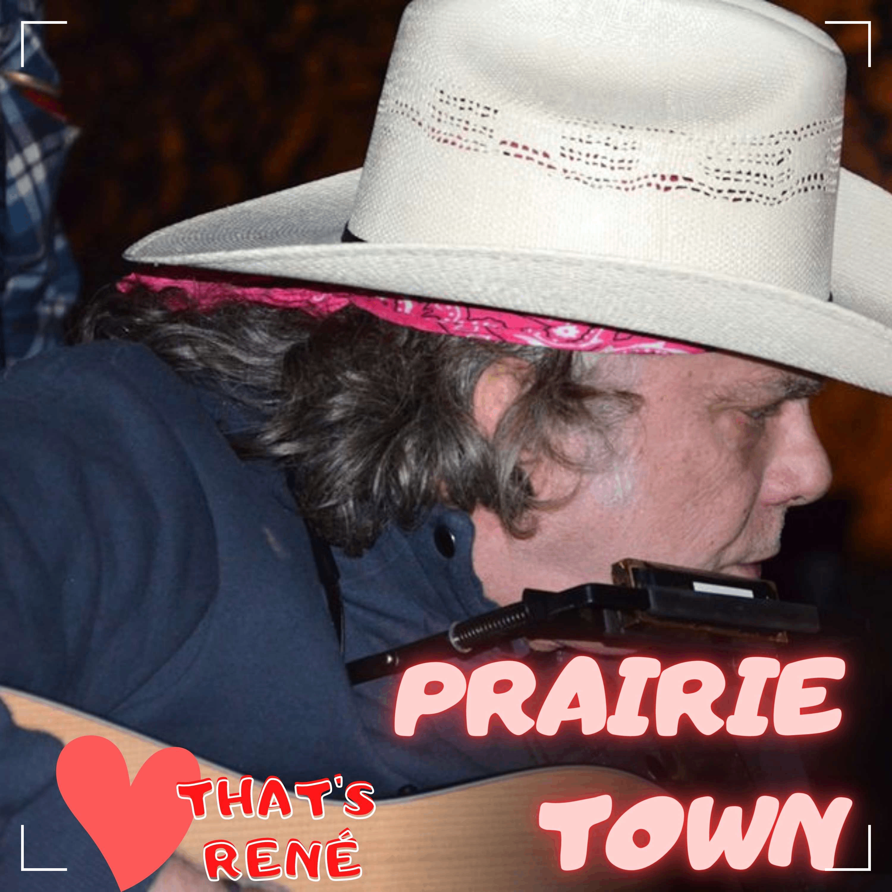 a man in a cowboy hat is holding an acoustic guitar