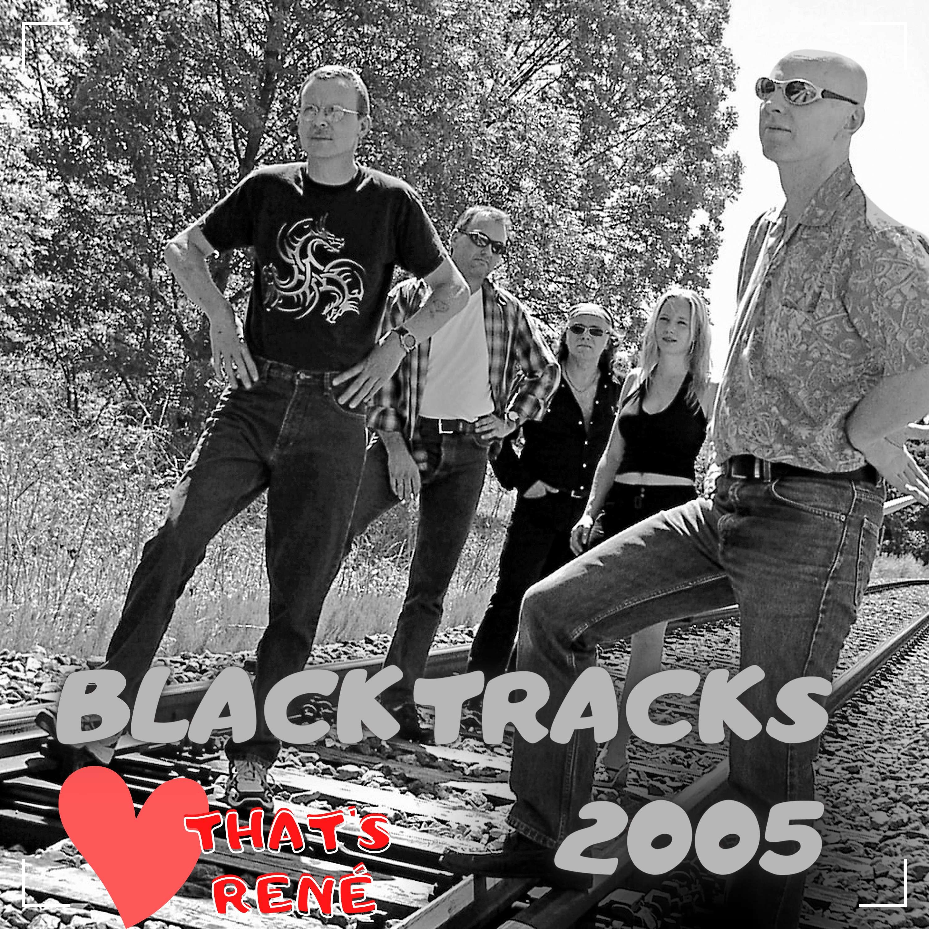 a black and white photo of a group of people on a train track