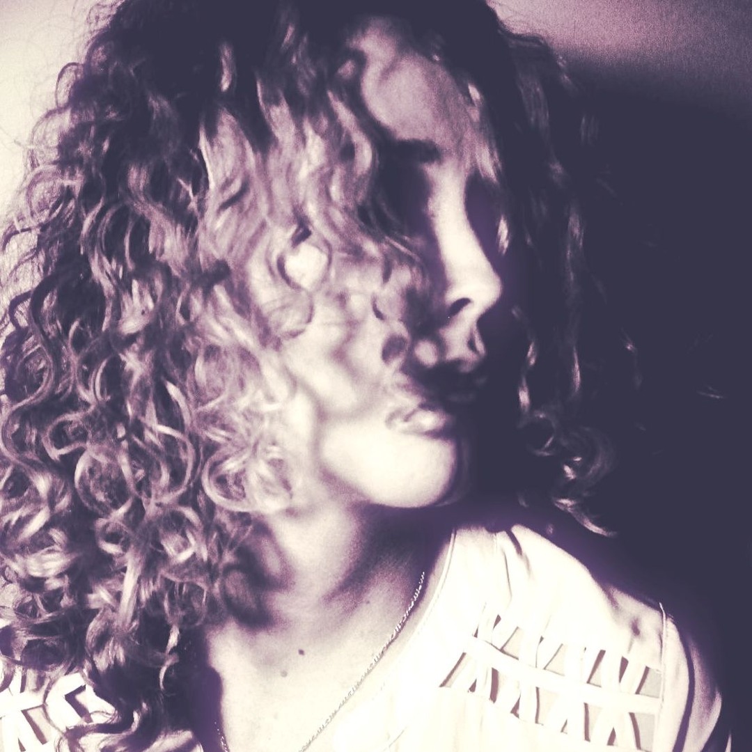 a woman with curly hair