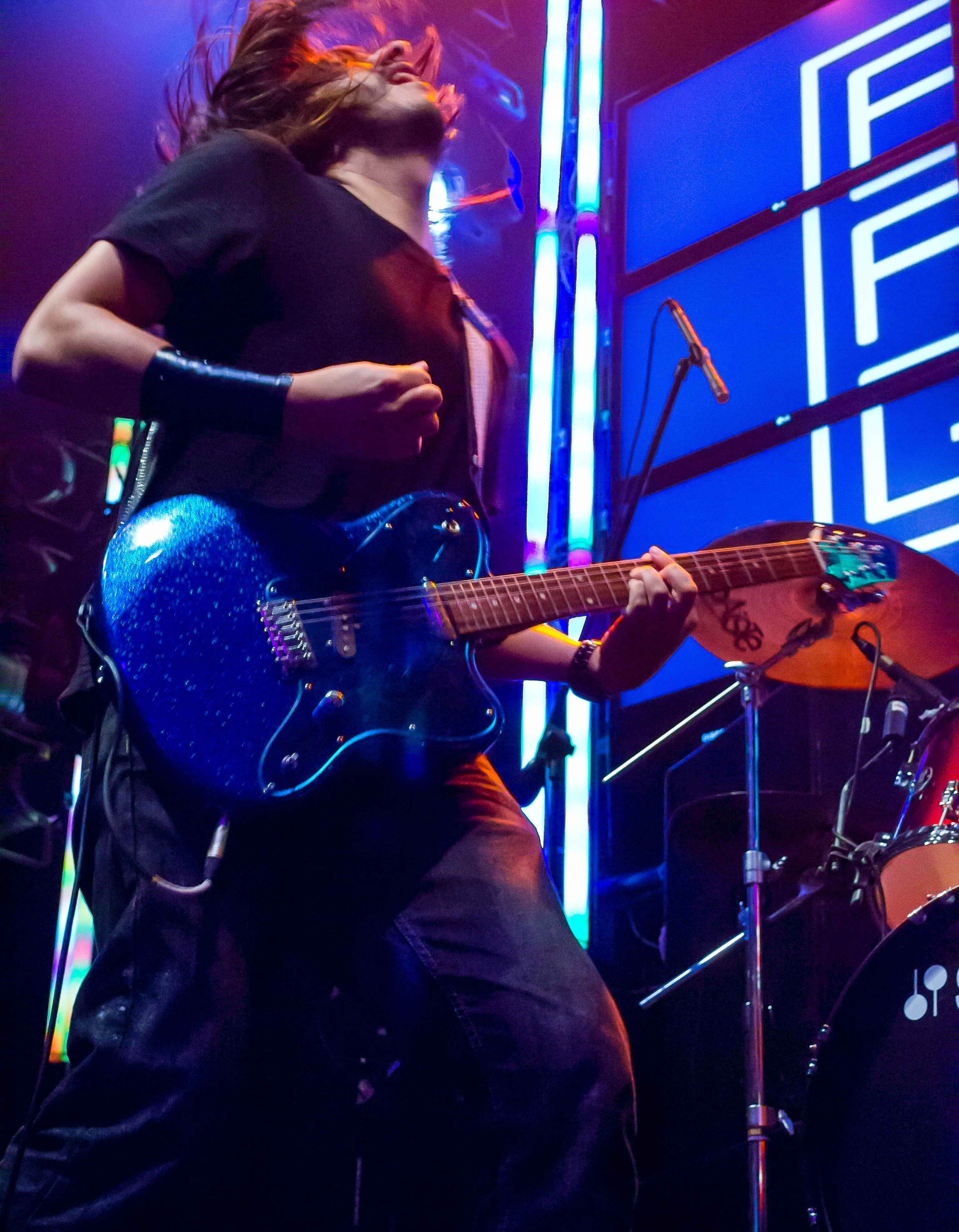 a man playing a guitar