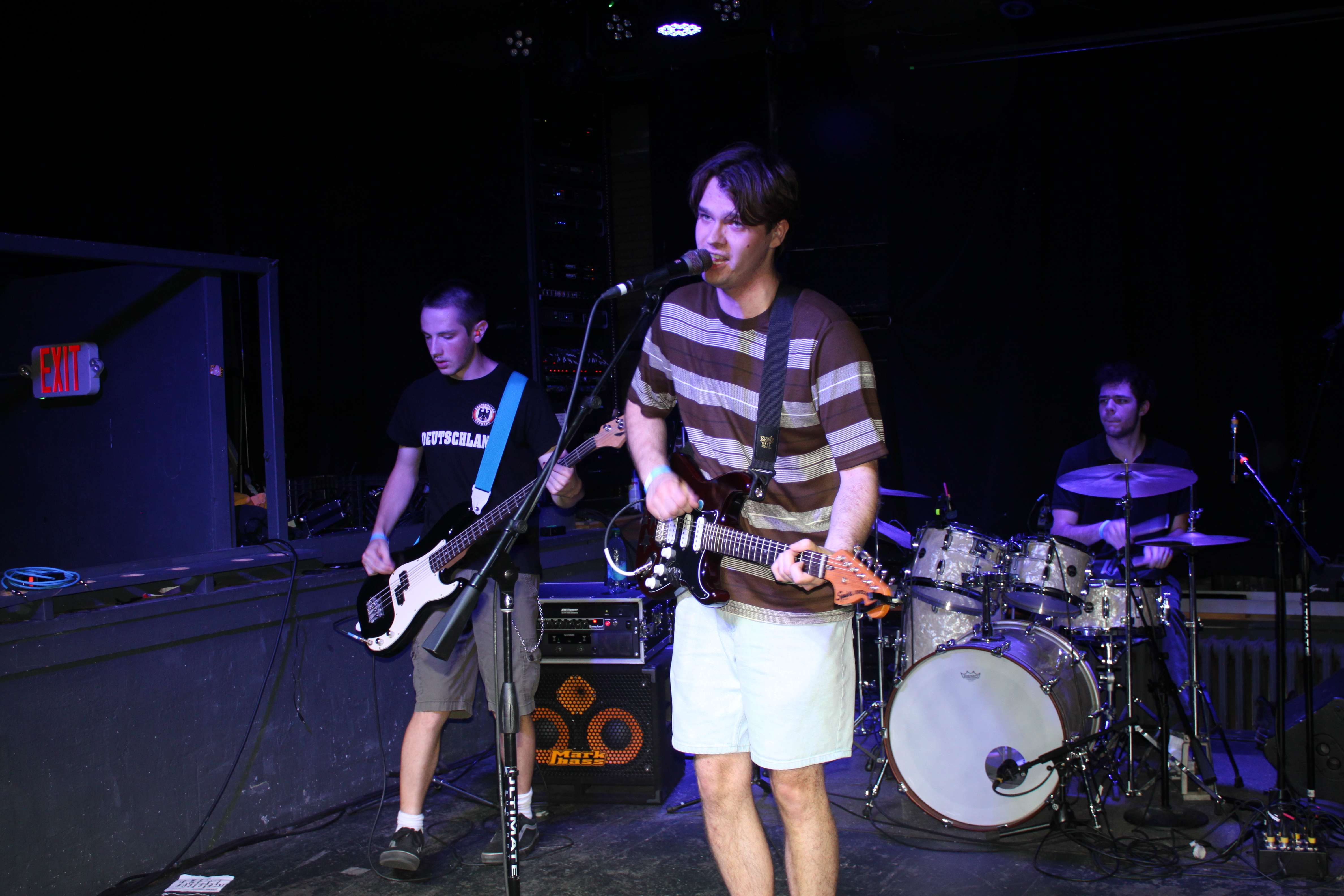 a man is playing a guitar on stage