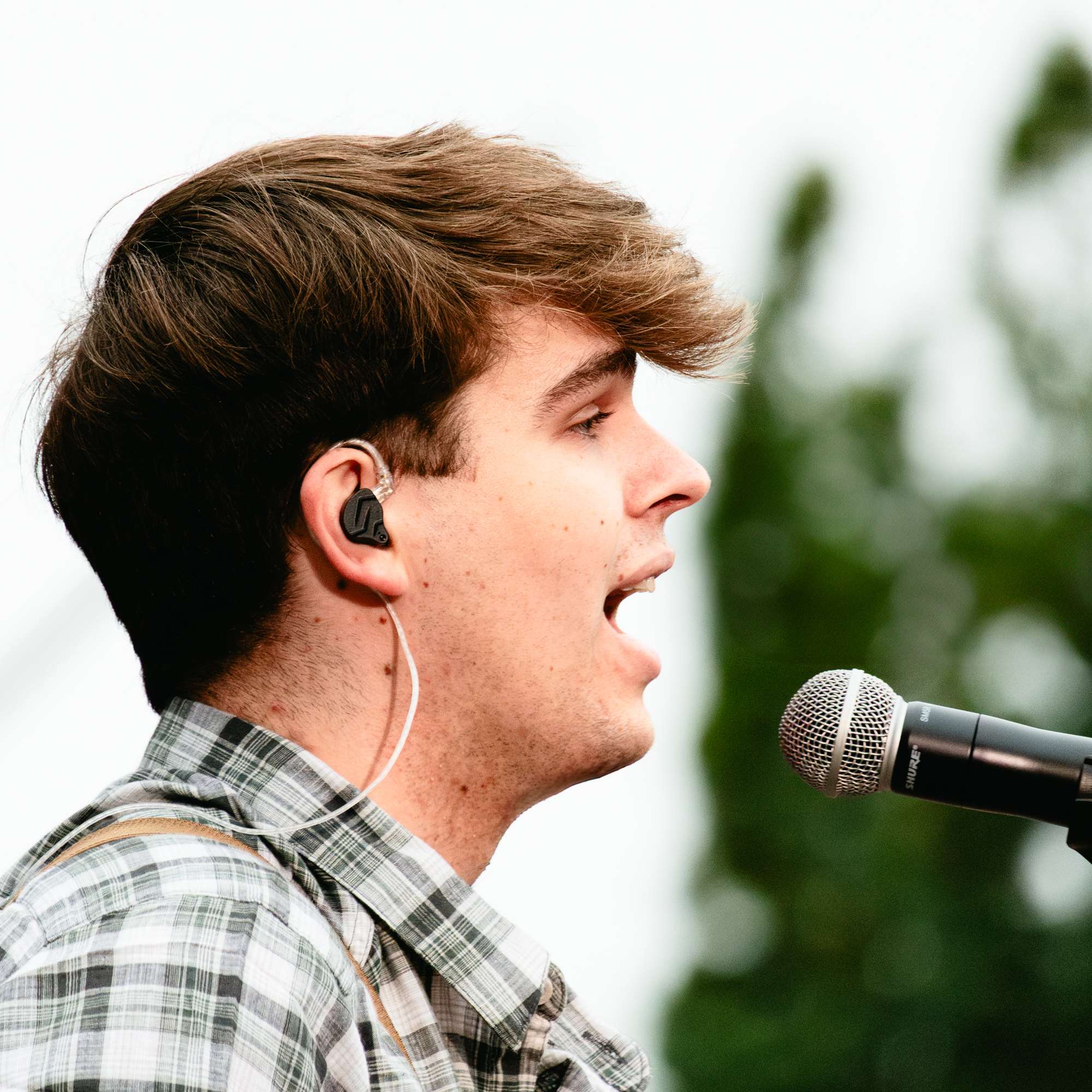 a man is singing into a microphone