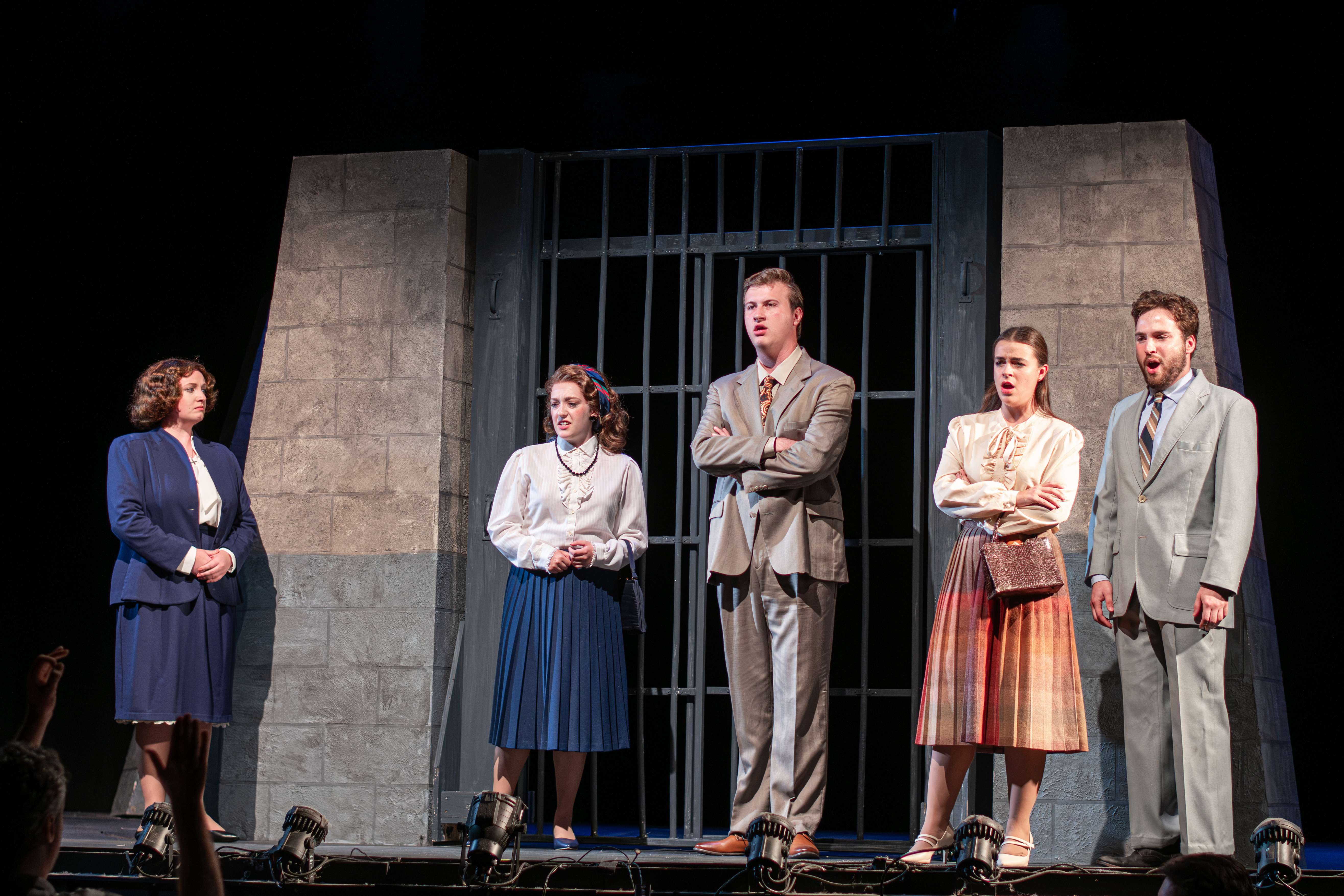 a group of people standing on a stage
