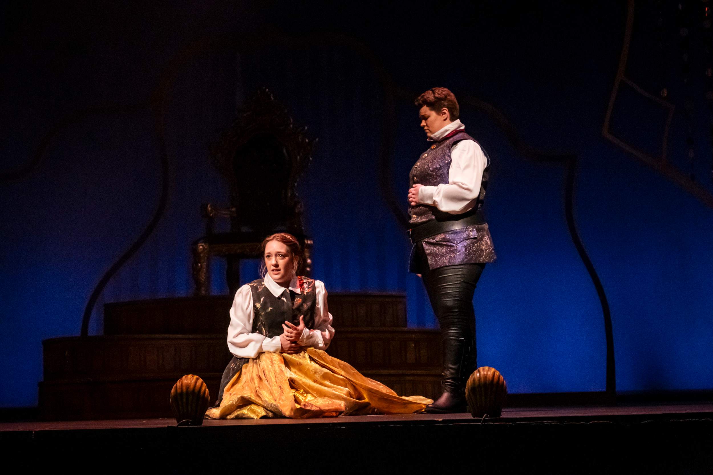 a man and woman on stage in beauty and the beast