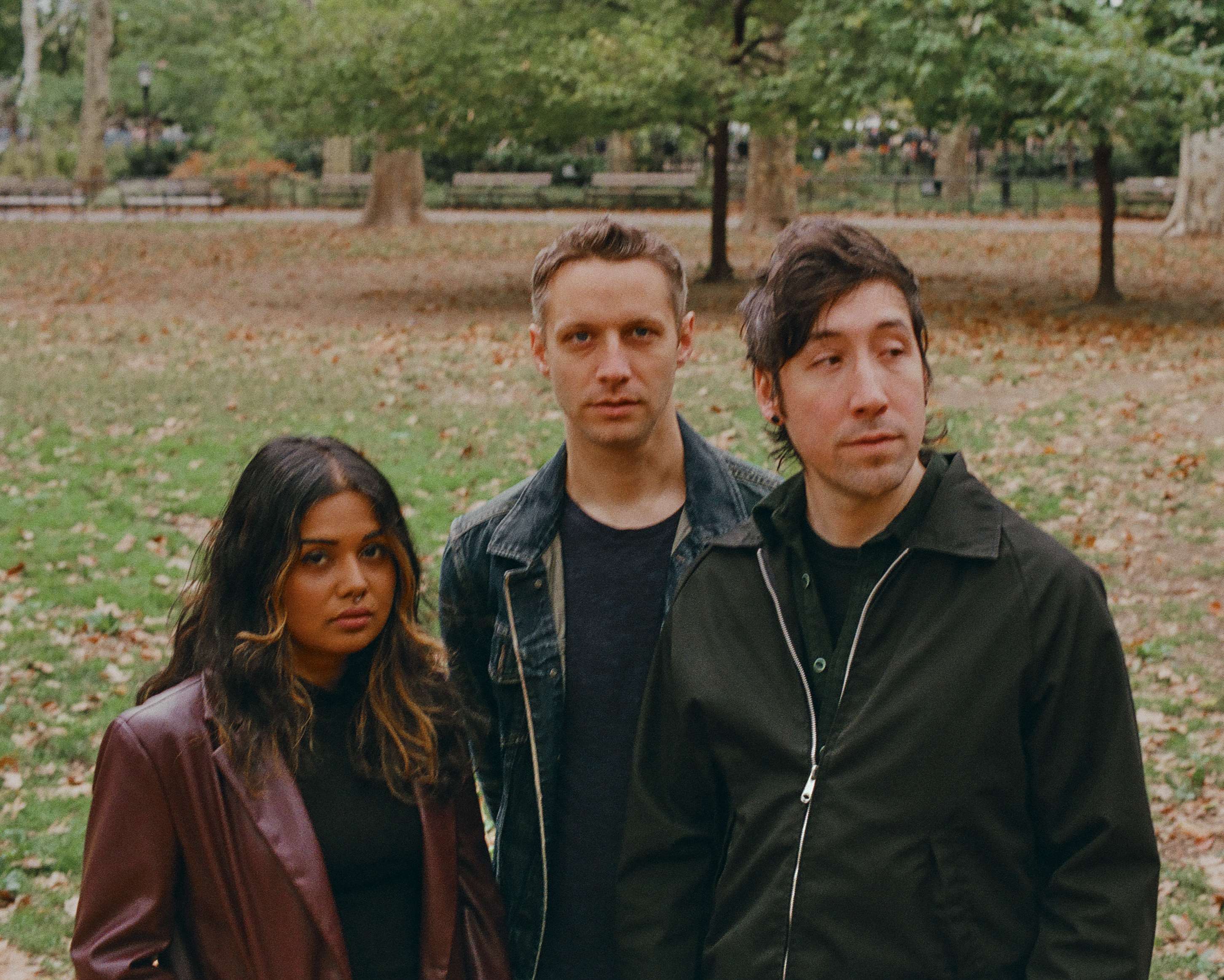 a group of people standing in a park