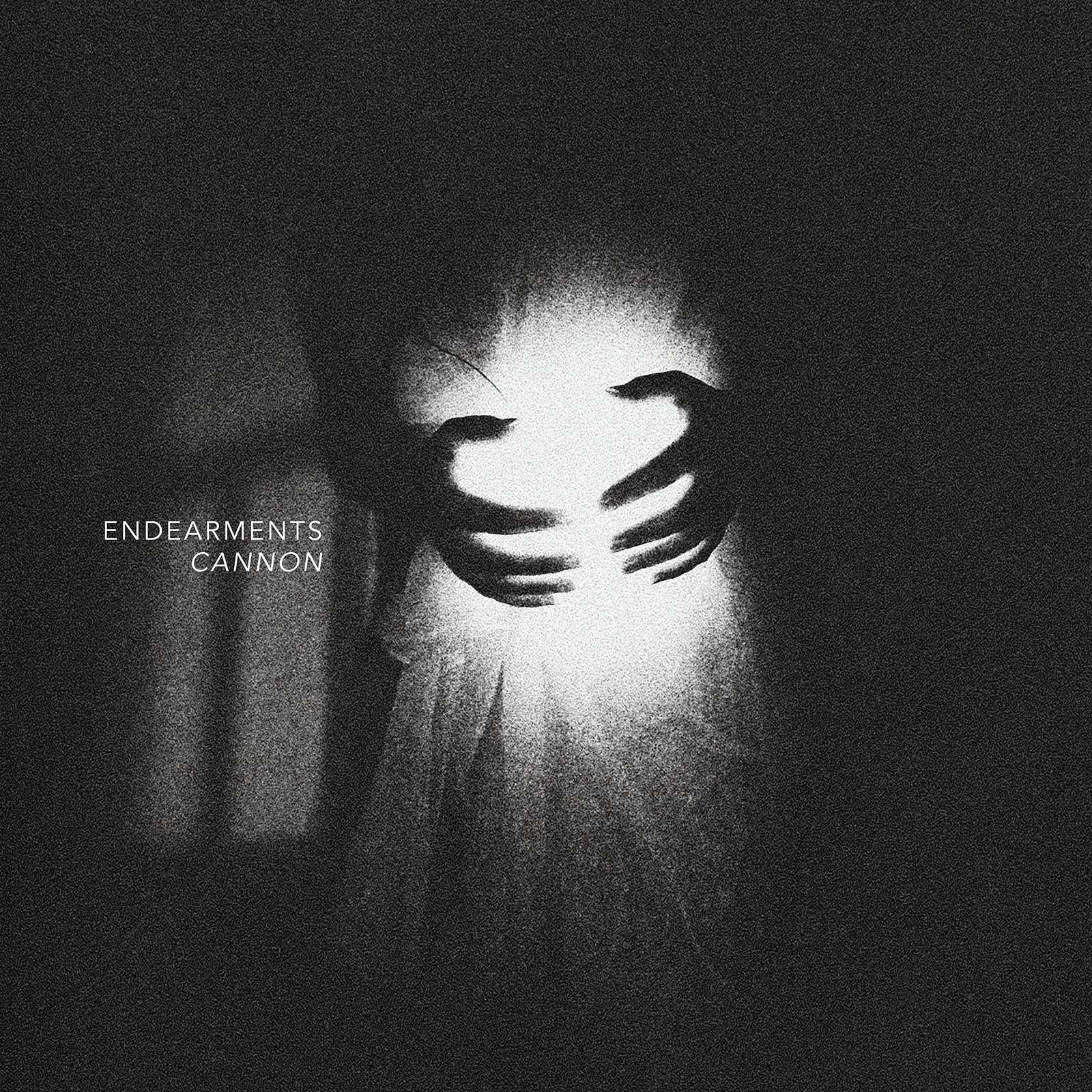 a black and white image of a woman holding a candle