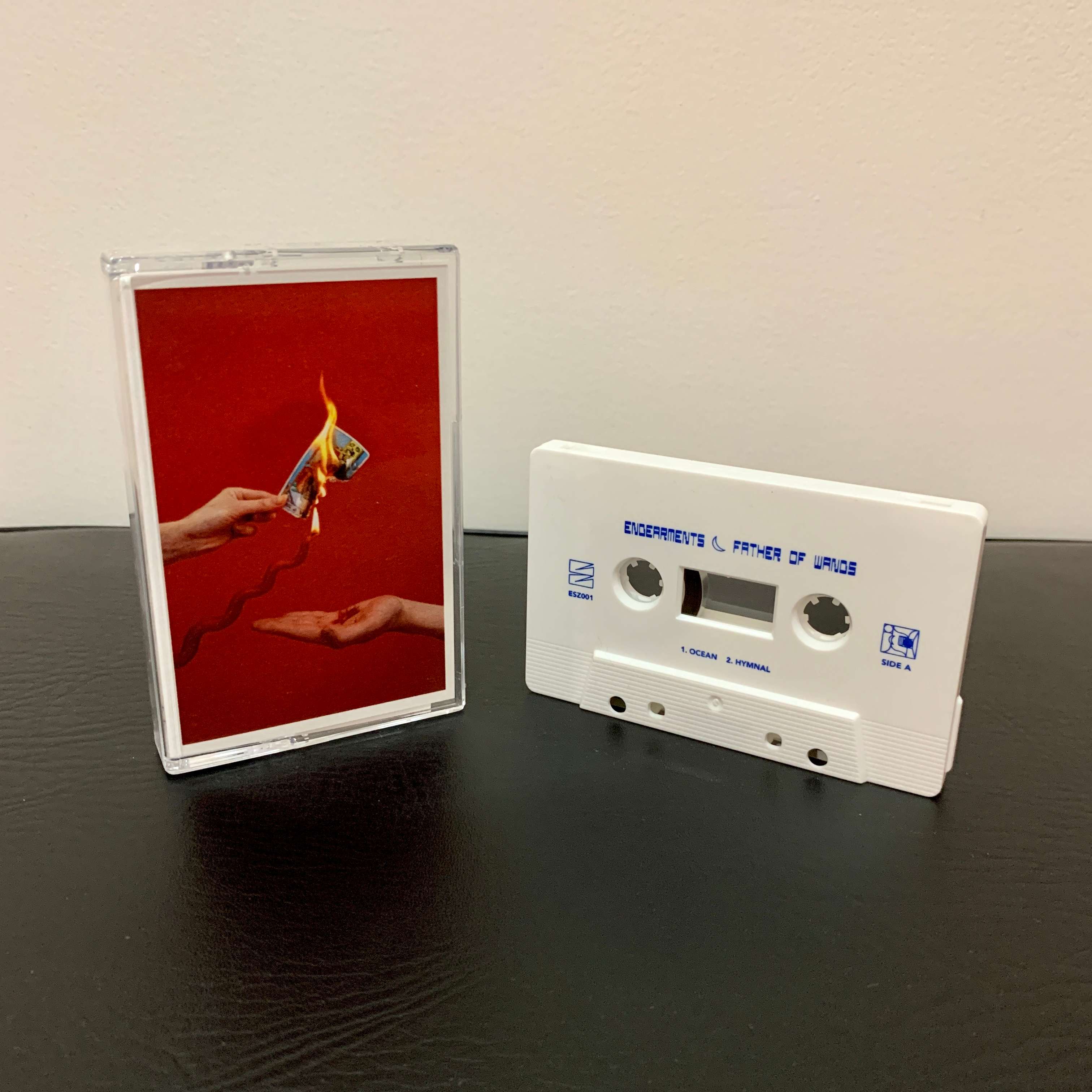 a cassette with a picture of a hand holding a lighter