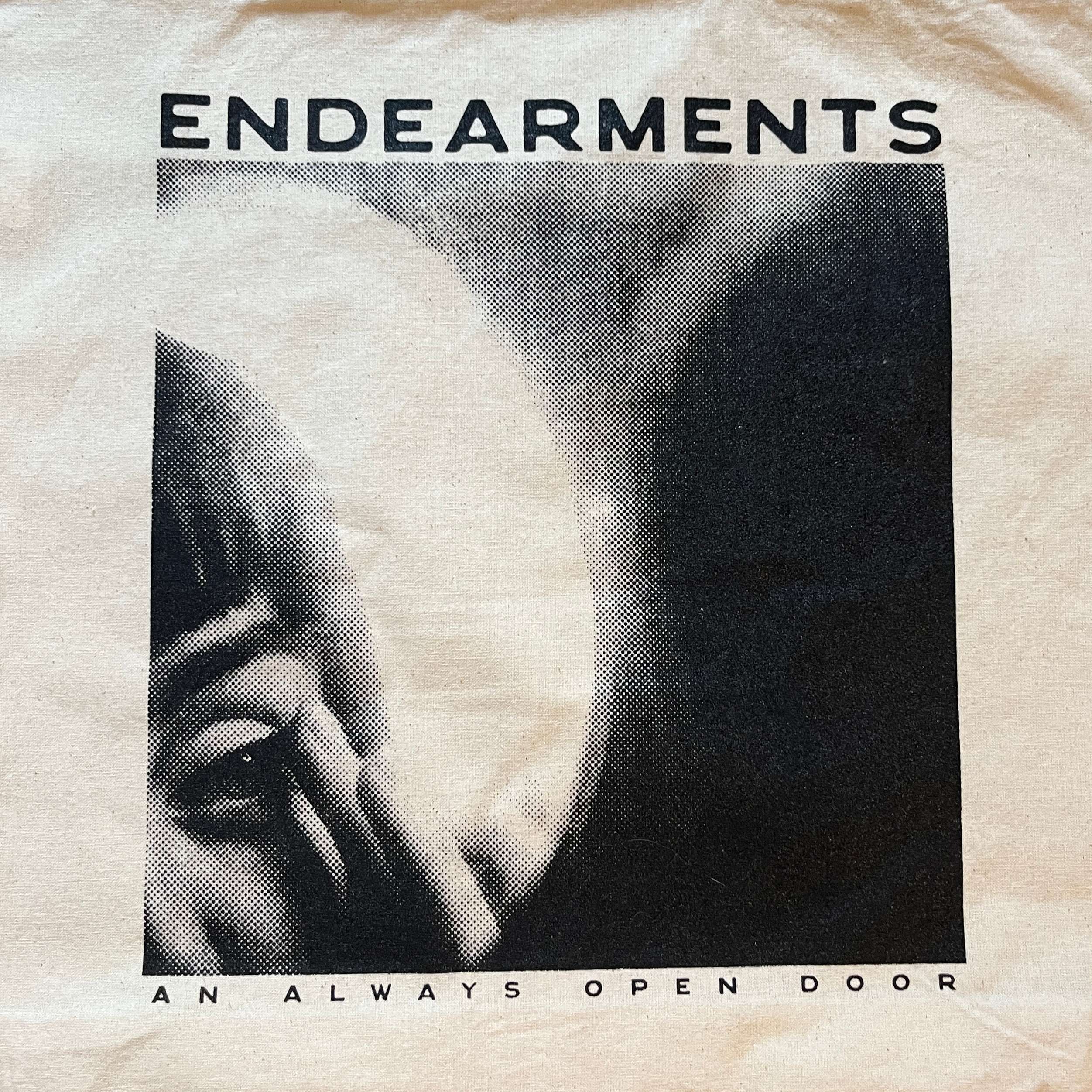 a tote bag with the words endearments an always open door