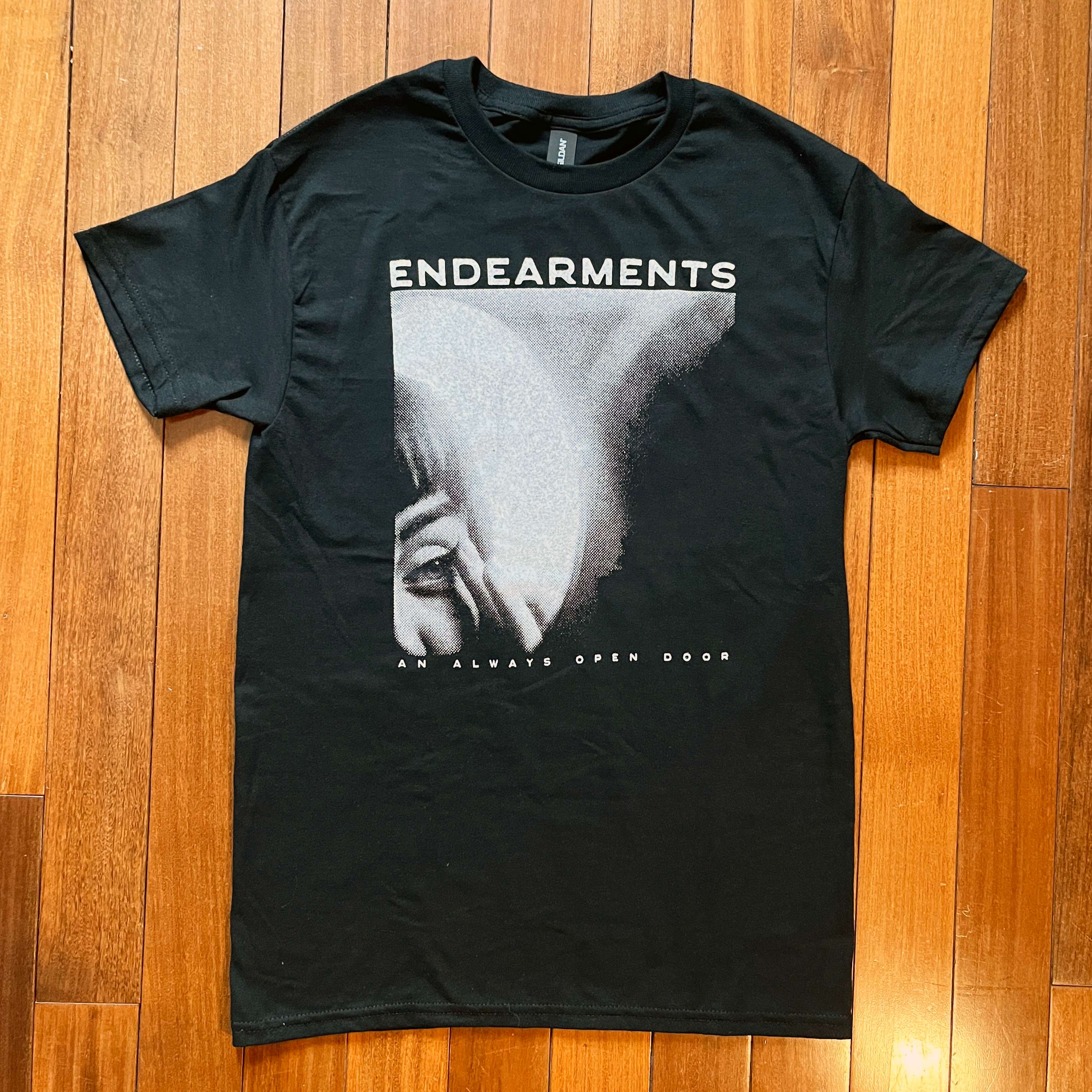 a black t - shirt with the words endearments on it