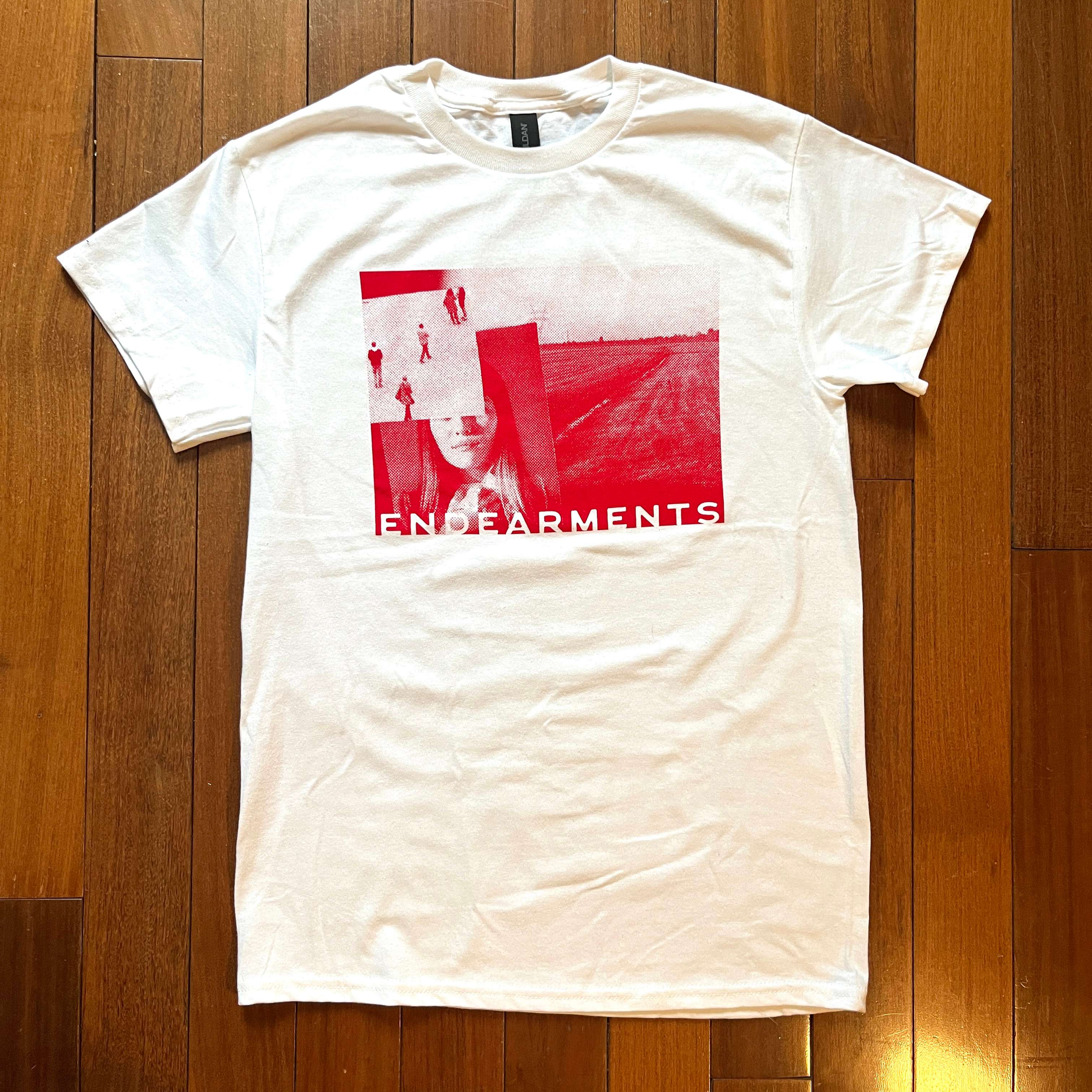 a white t - shirt with a red image on it