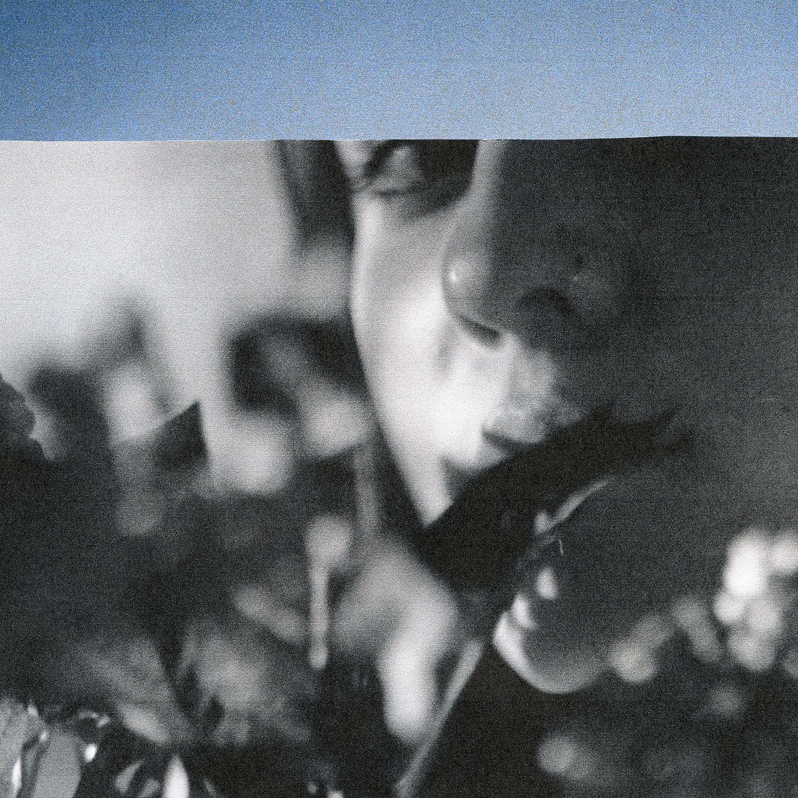 a black and white photo of a woman holding flowers