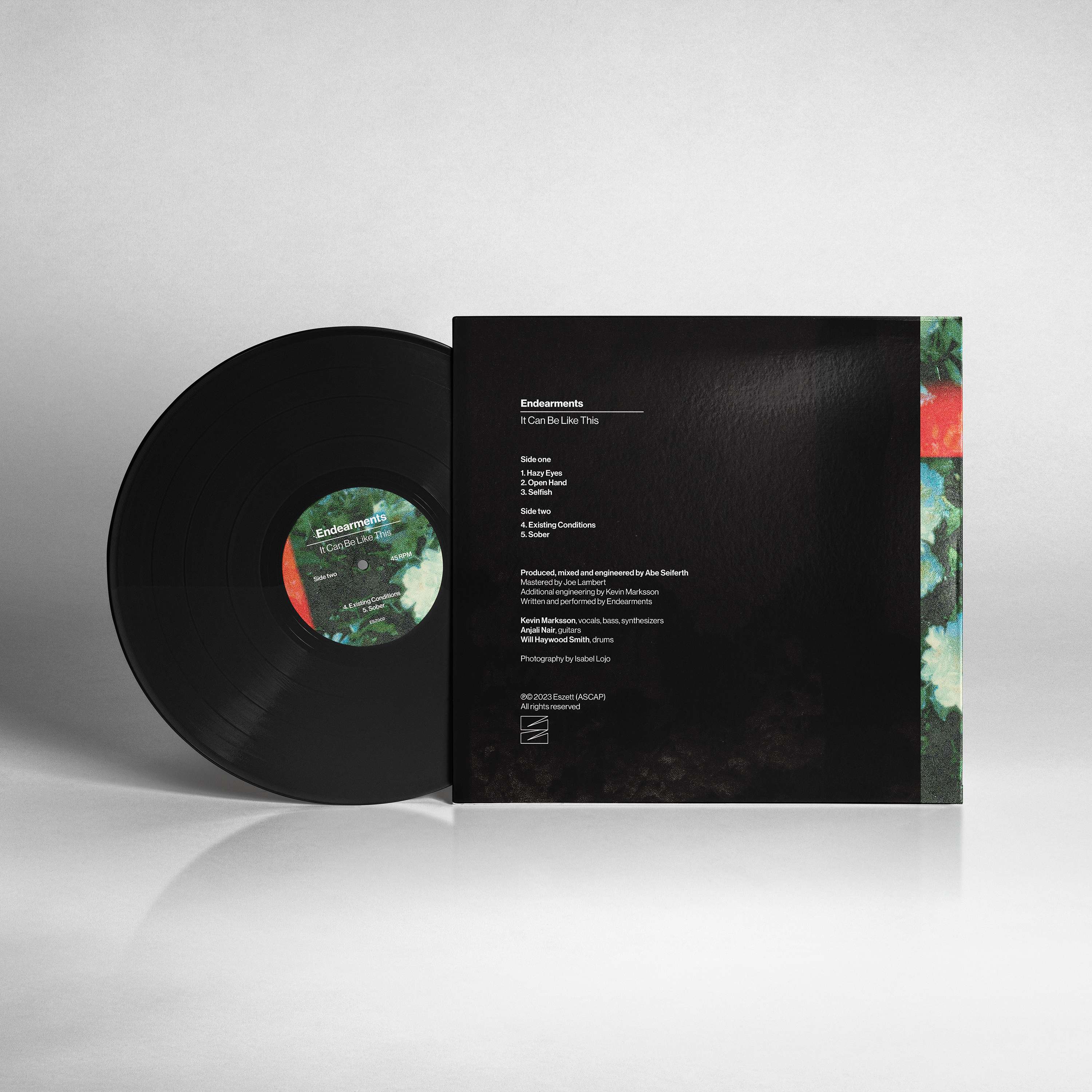 a black lp with a flower on it