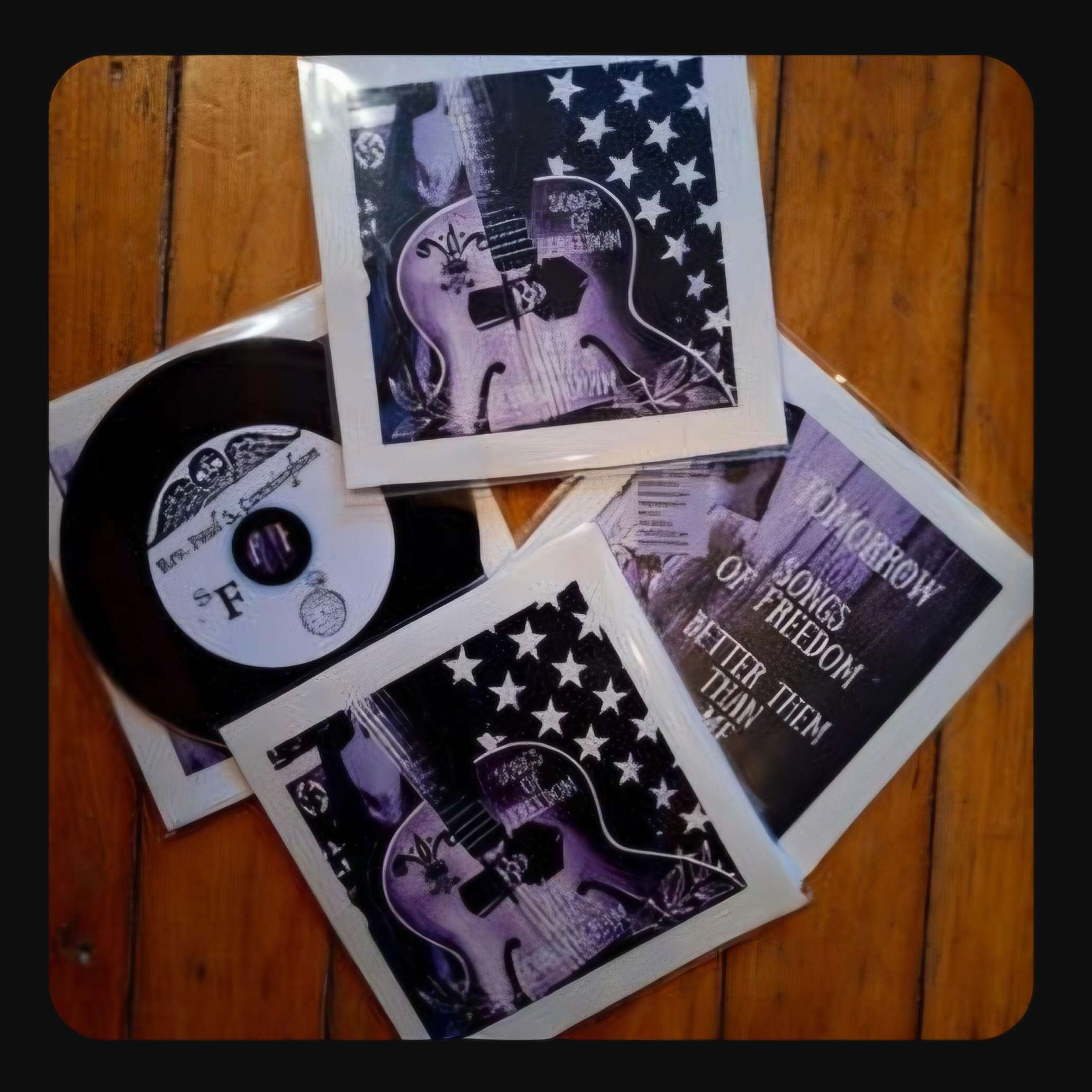 three cds and a cd with an american flag on them