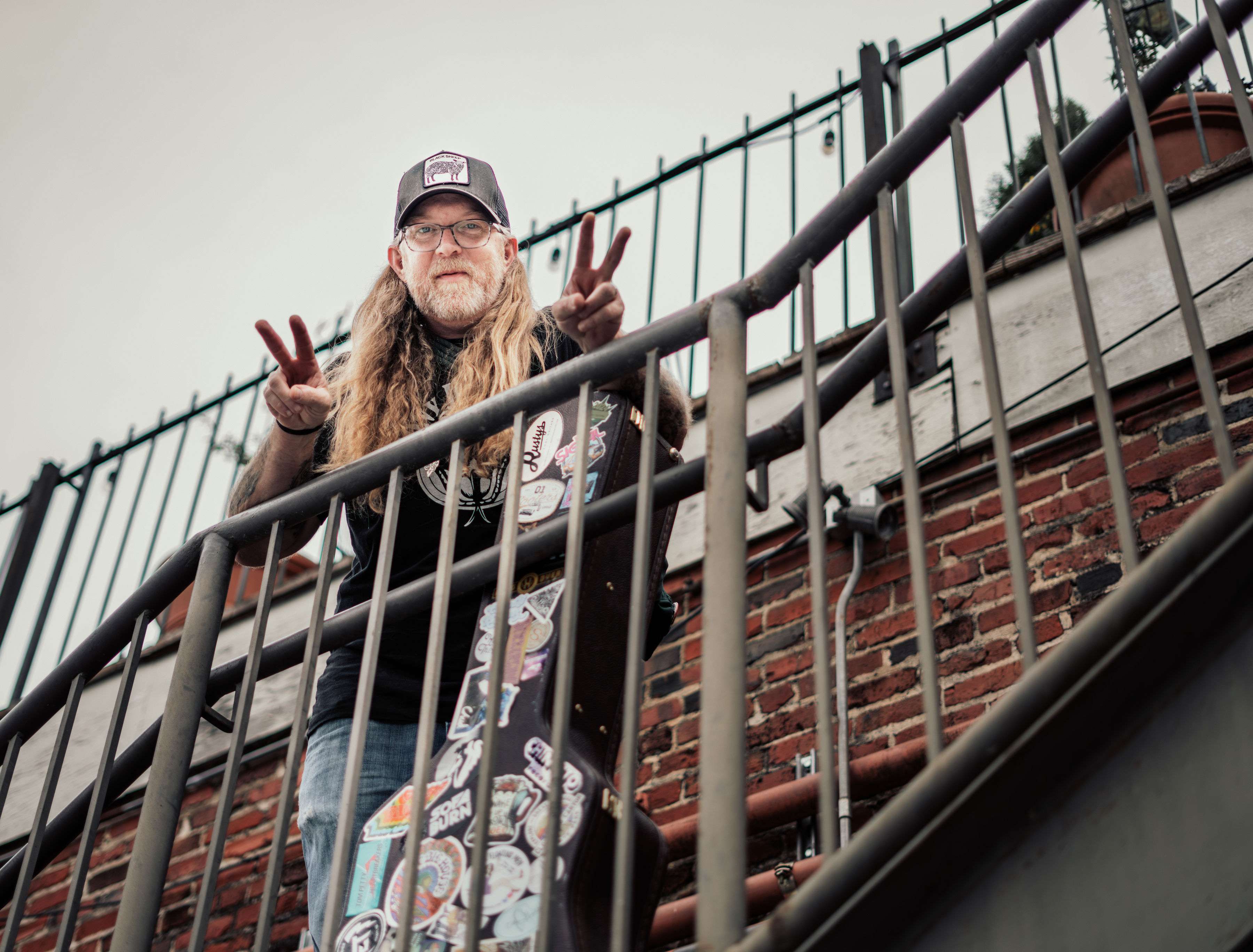 a man with a skateboard on a railing