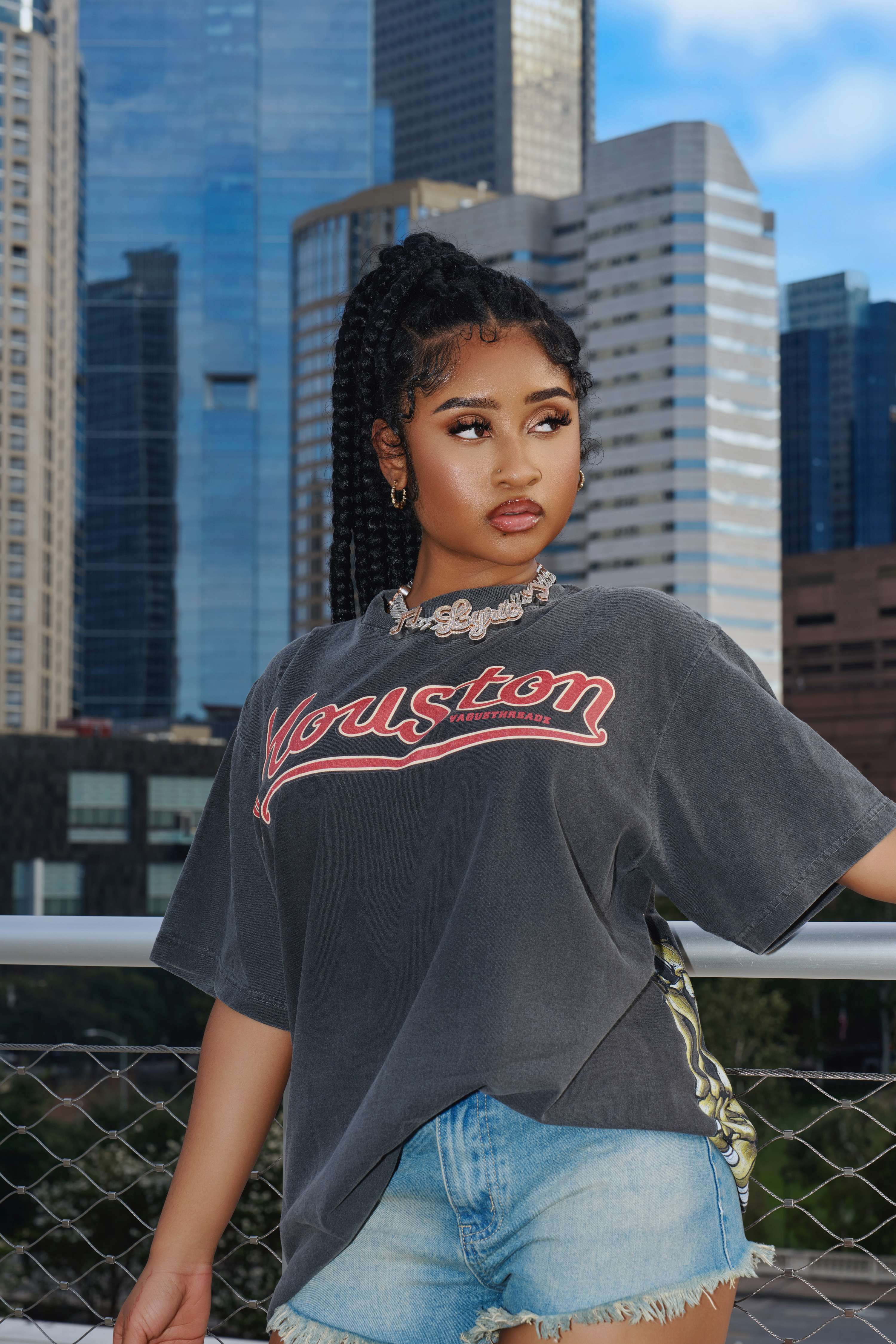 a young woman wearing a t - shirt and shorts