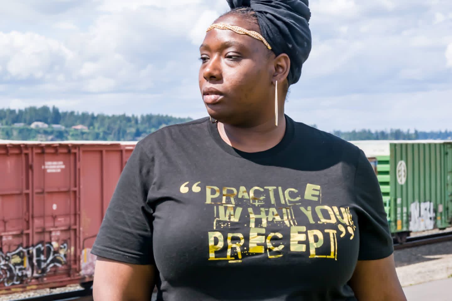 a woman wearing a t - shirt that says practice in the love of preep