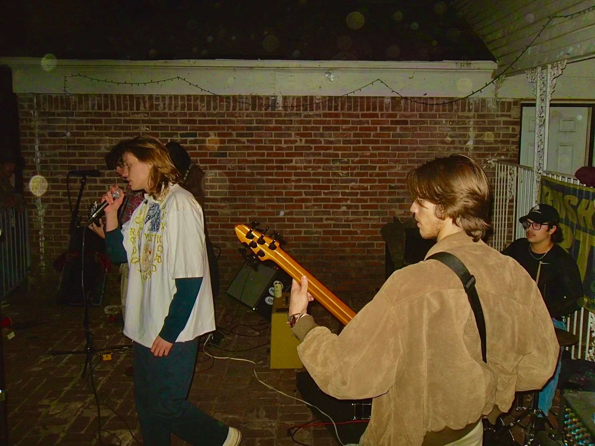 a group of people playing music in a backyard