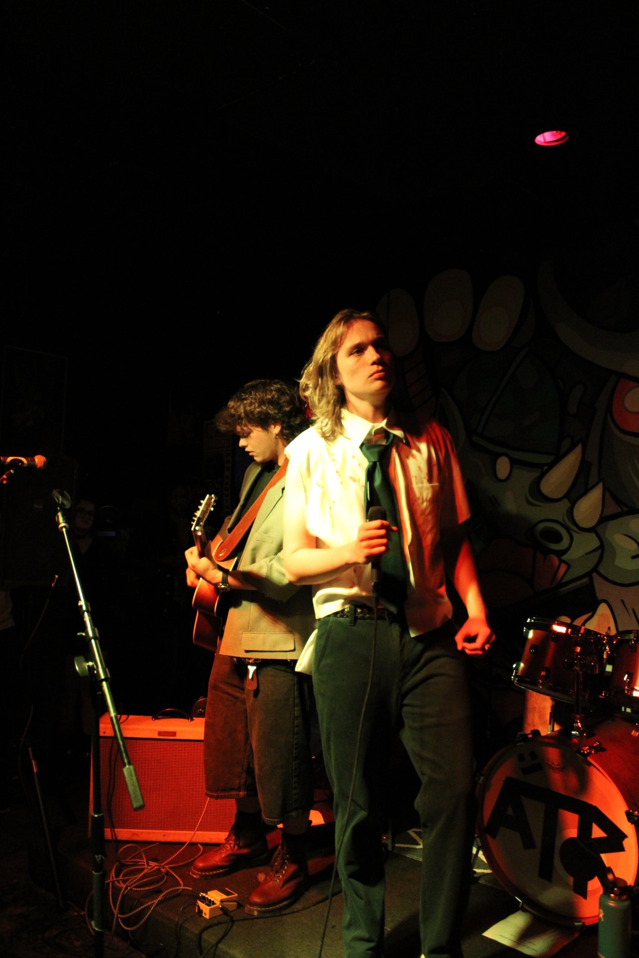 a man standing on stage with a microphone