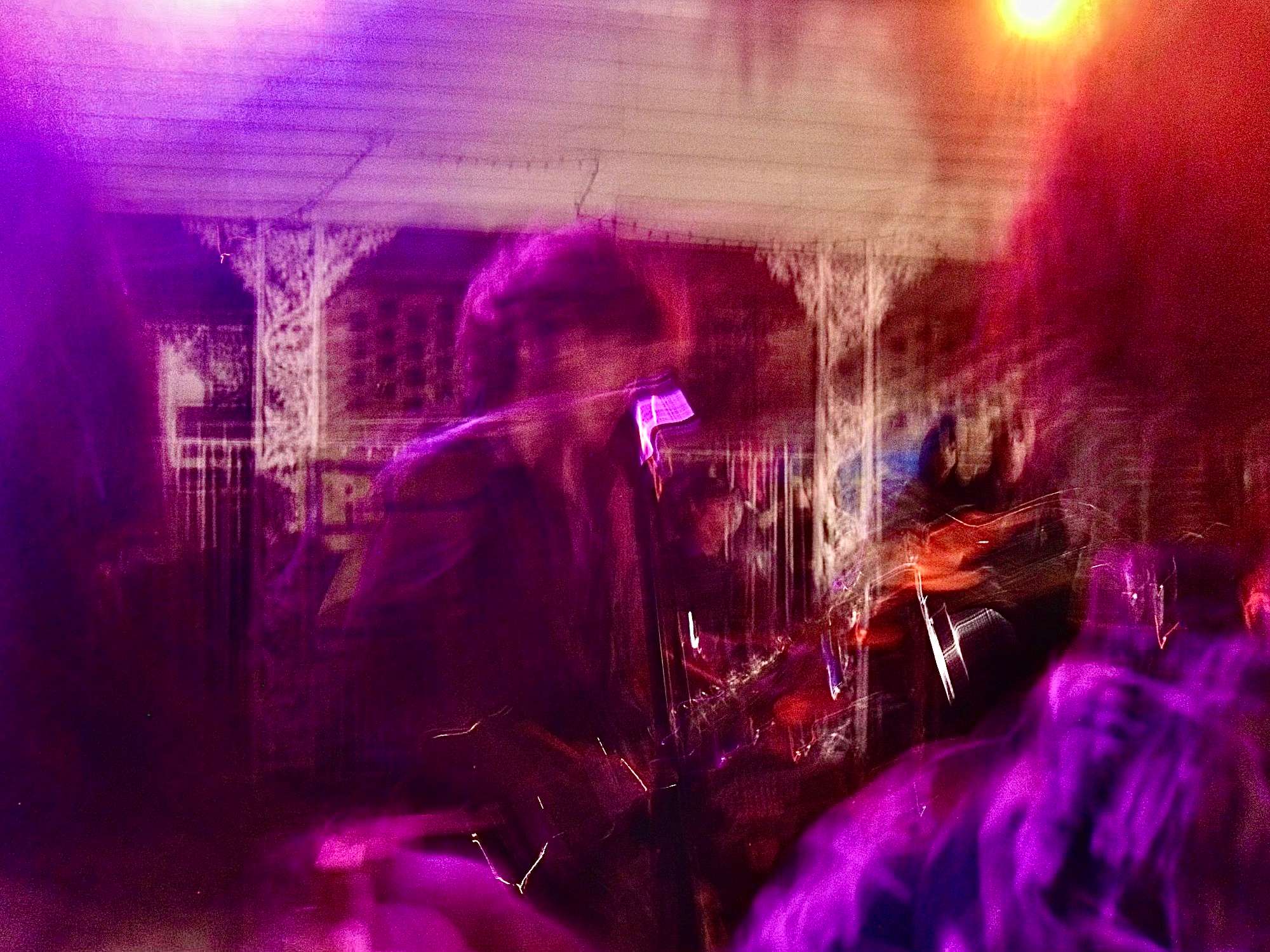 a blurry image of a group of people on stage