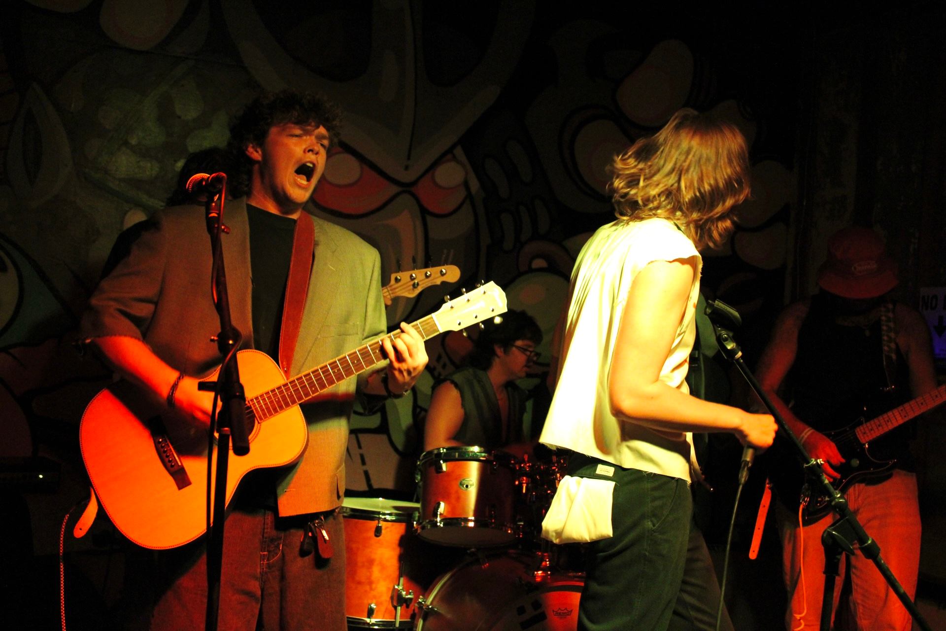 a man playing an acoustic guitar