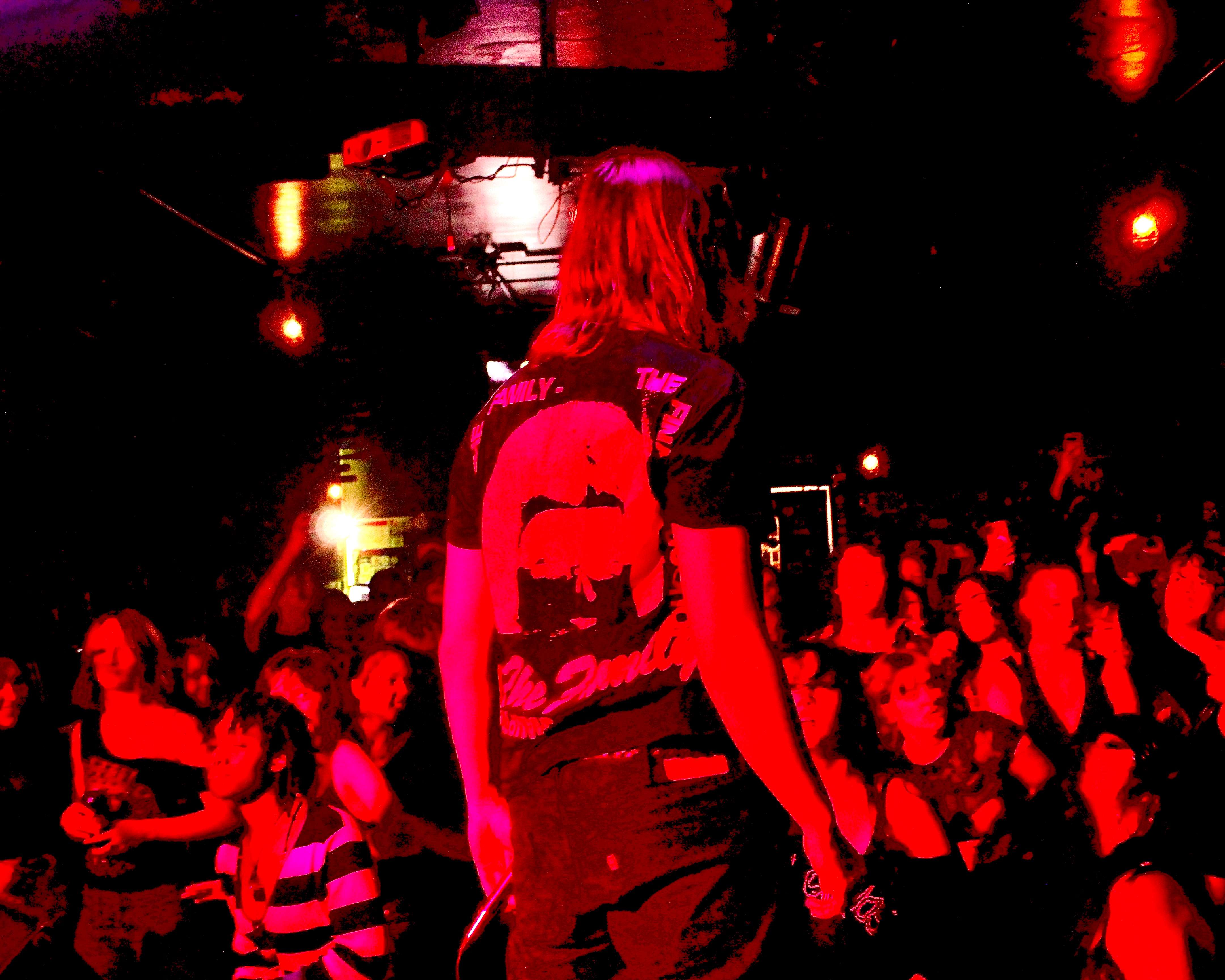 a man standing on a stage in front of a crowd