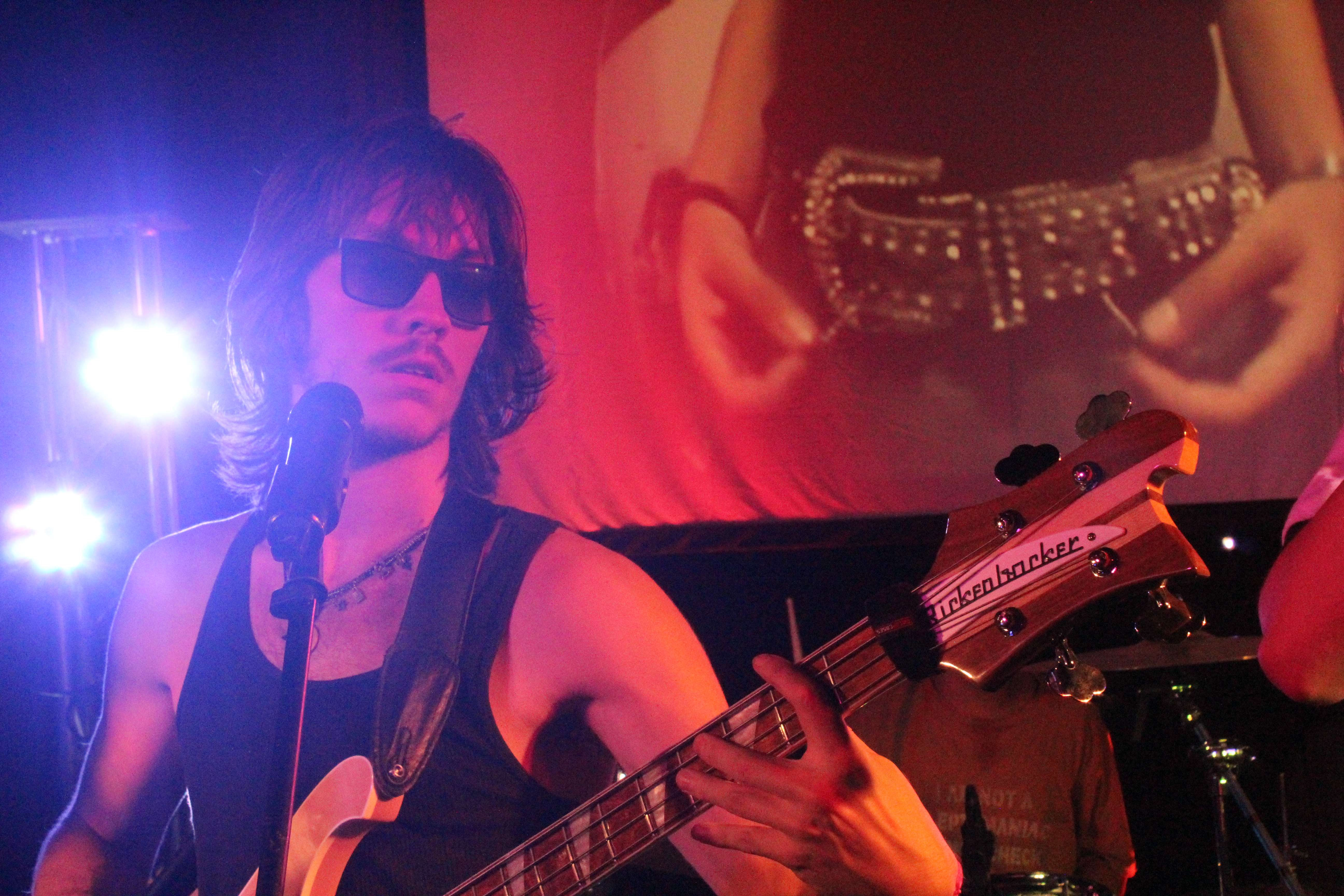 a man holding a guitar