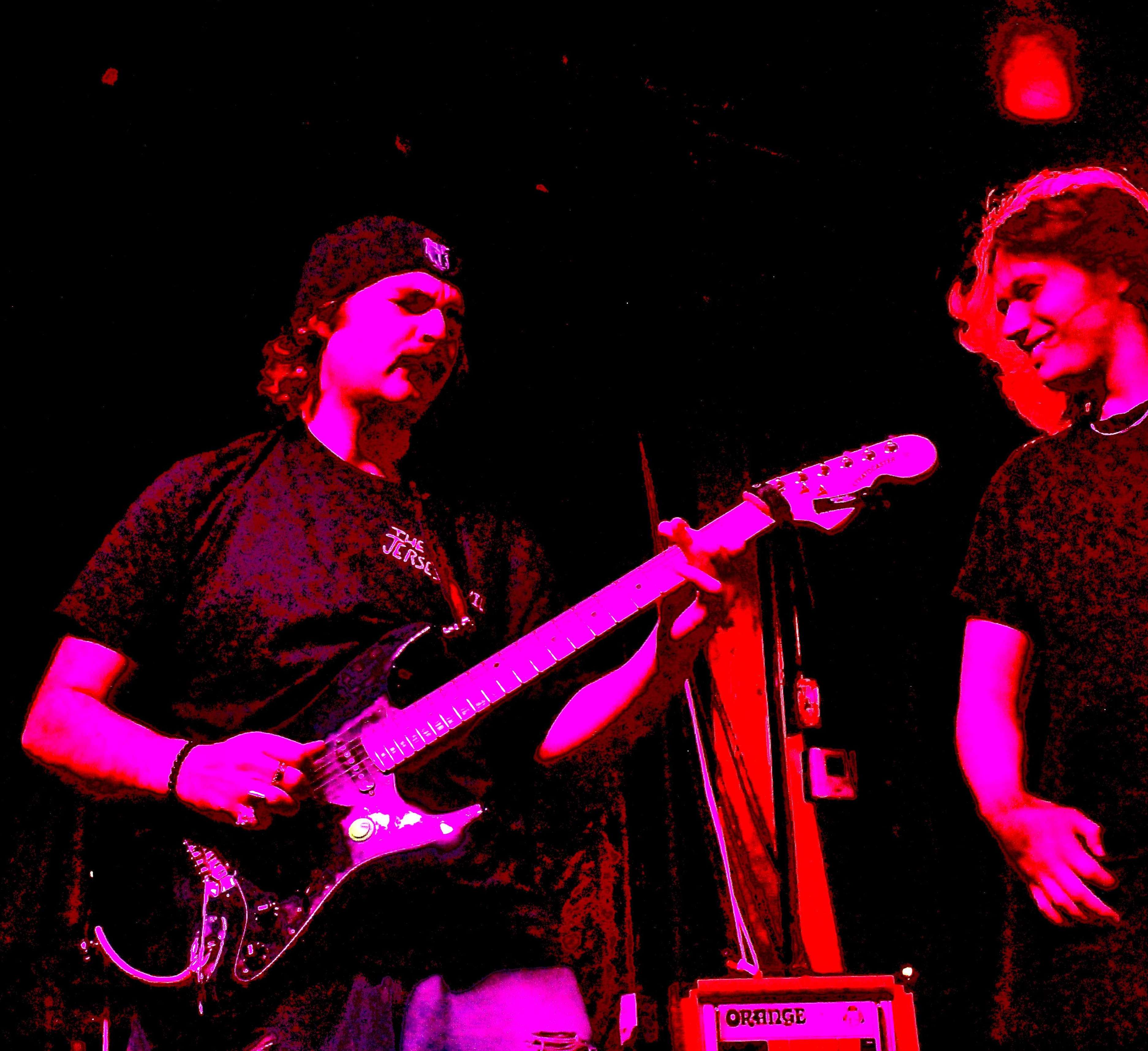 a man is playing a guitar