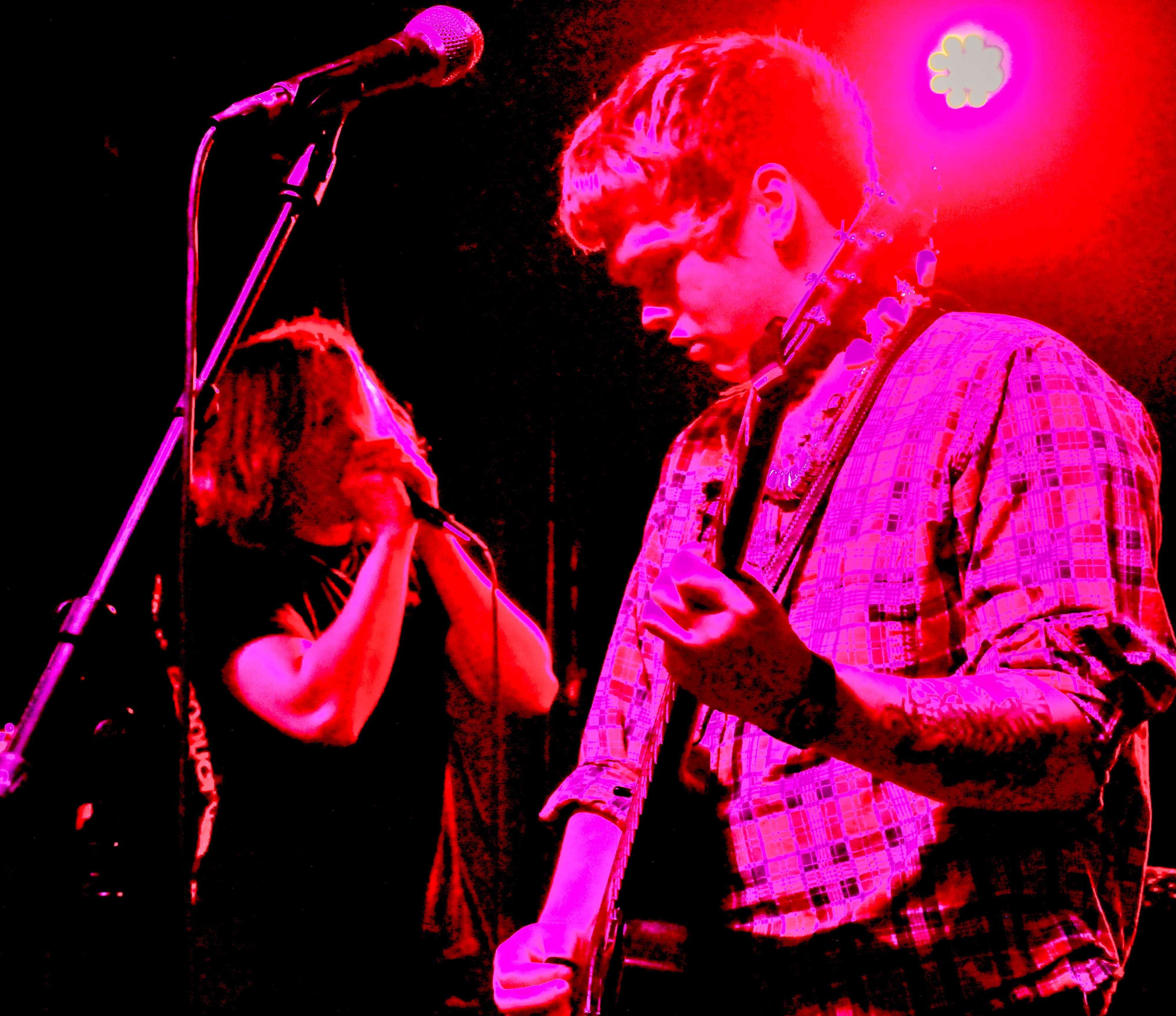 a man is playing a guitar