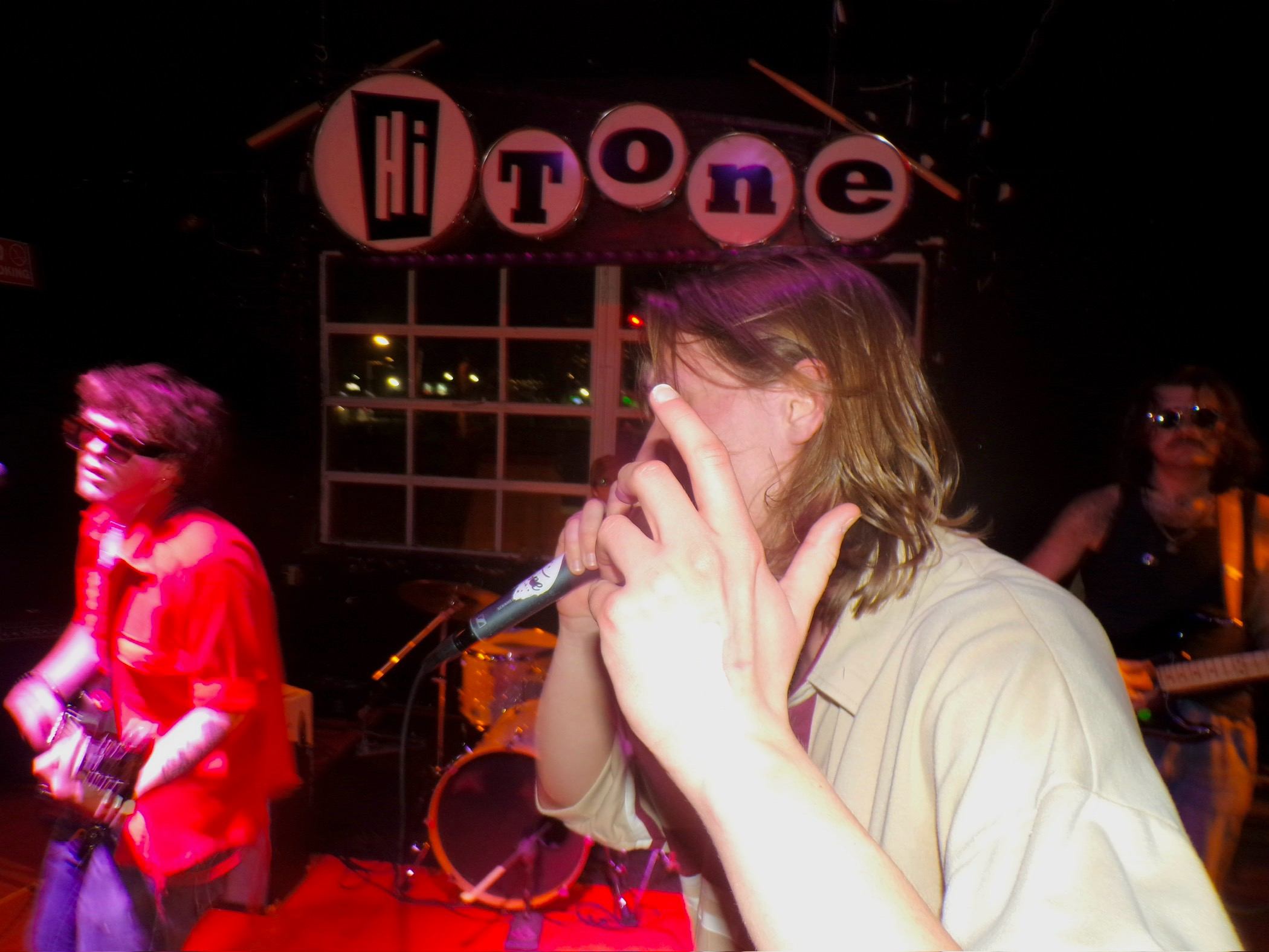 a man singing into a microphone