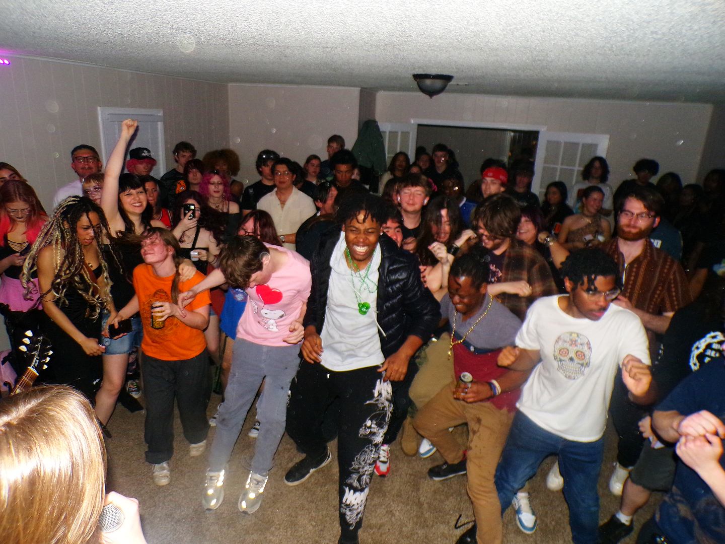a group of people dancing in a room