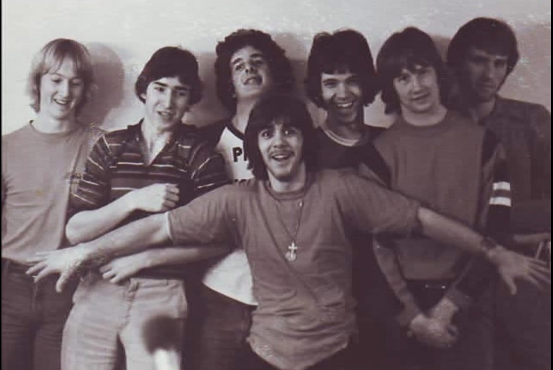 a group of young men posing for a photo