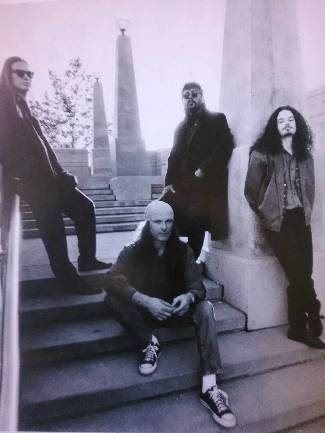 a black and white photo of a group of men posing