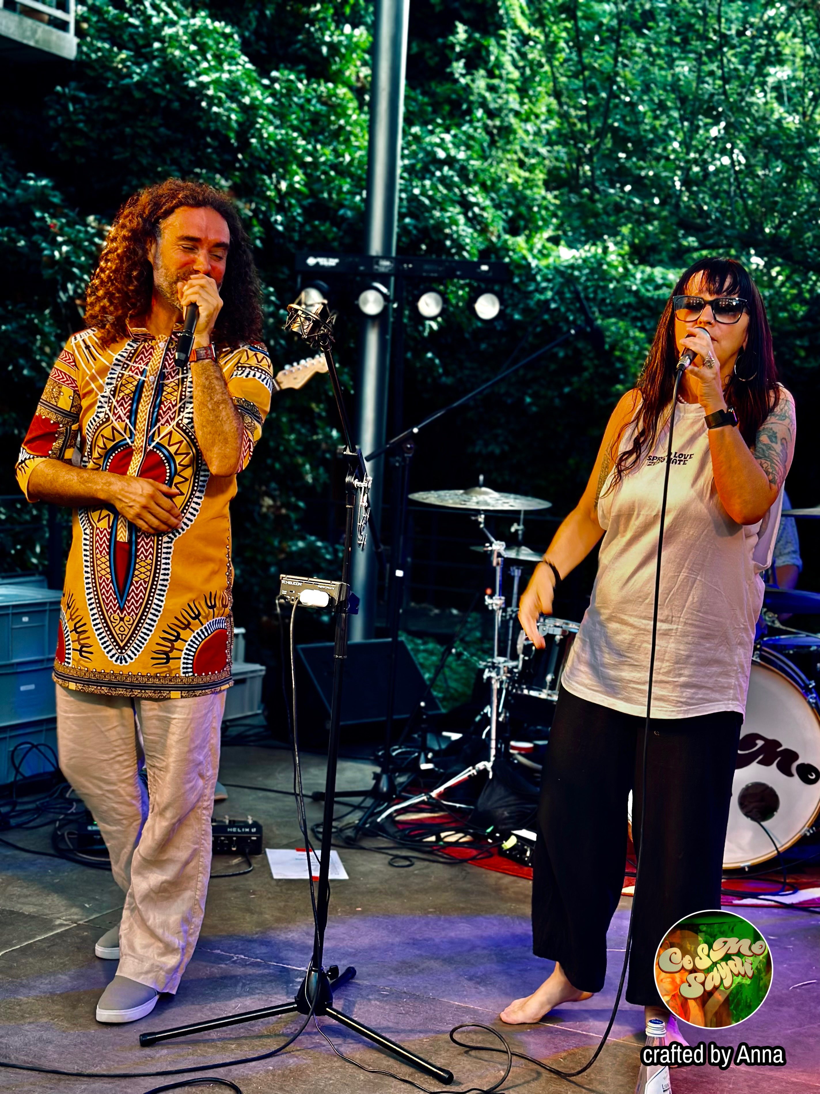a man and a woman singing on stage