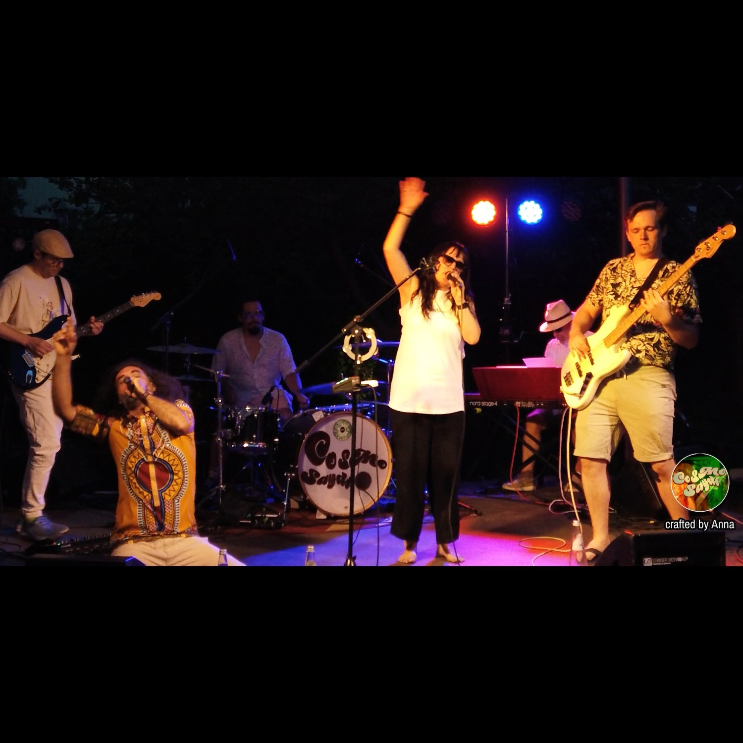 a group of people performing on stage at a concert