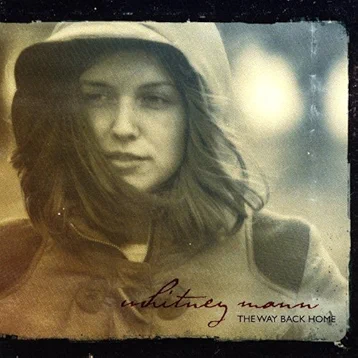 a photo of a woman wearing a hooded jacket