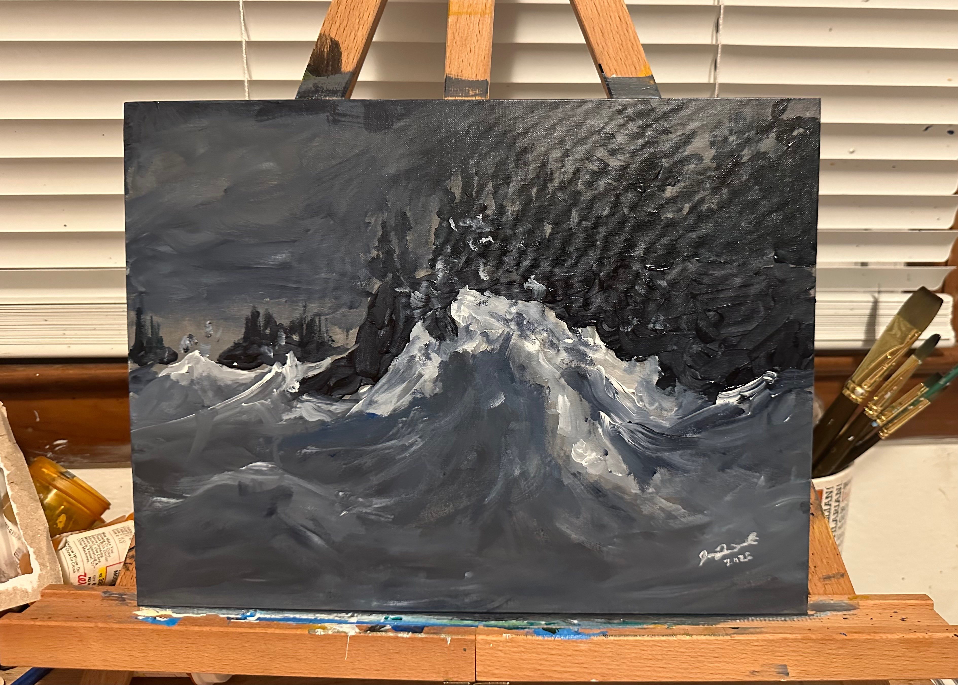 a painting of a stormy sea on an easel