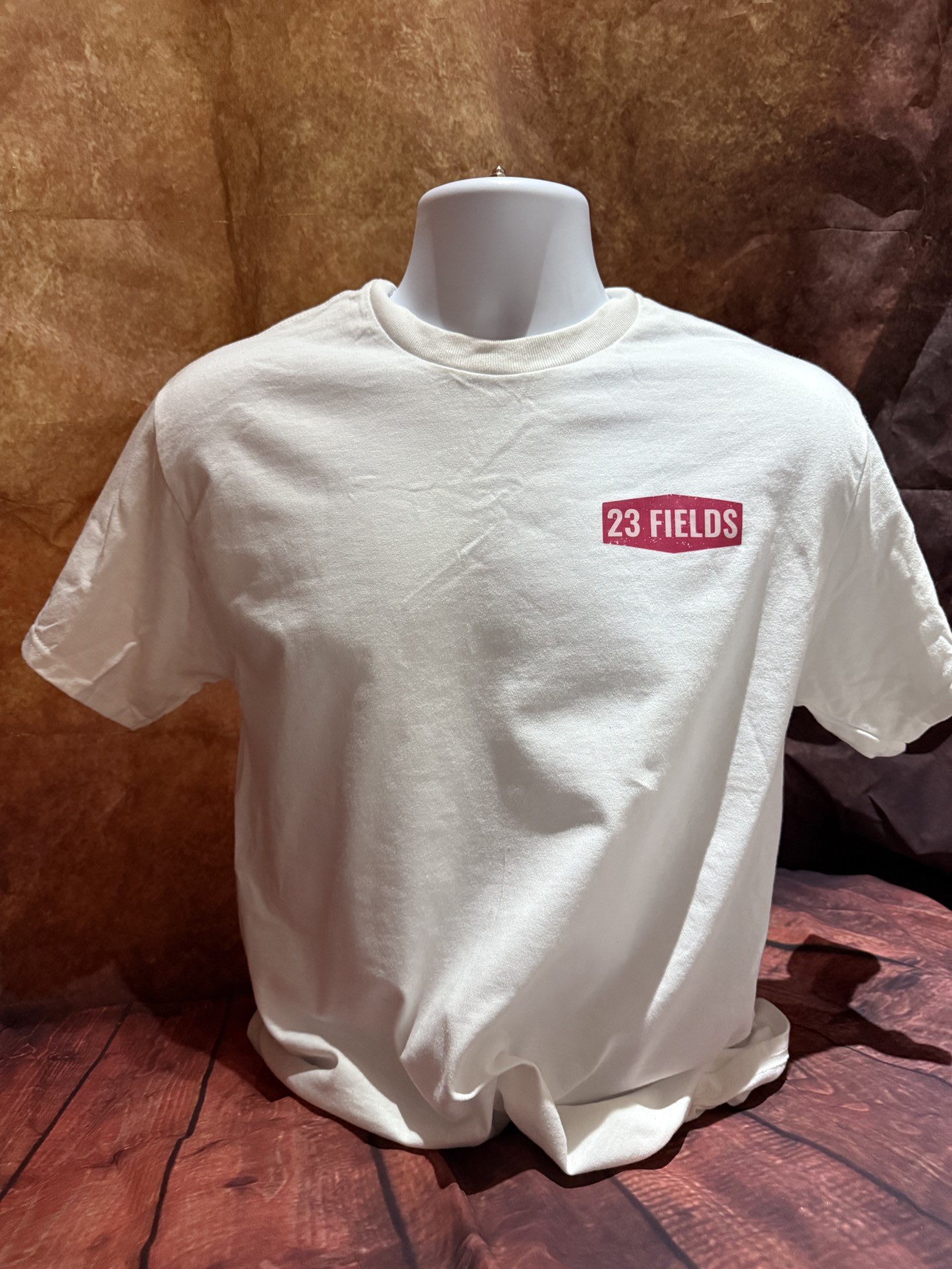 a white t - shirt with a red logo on it