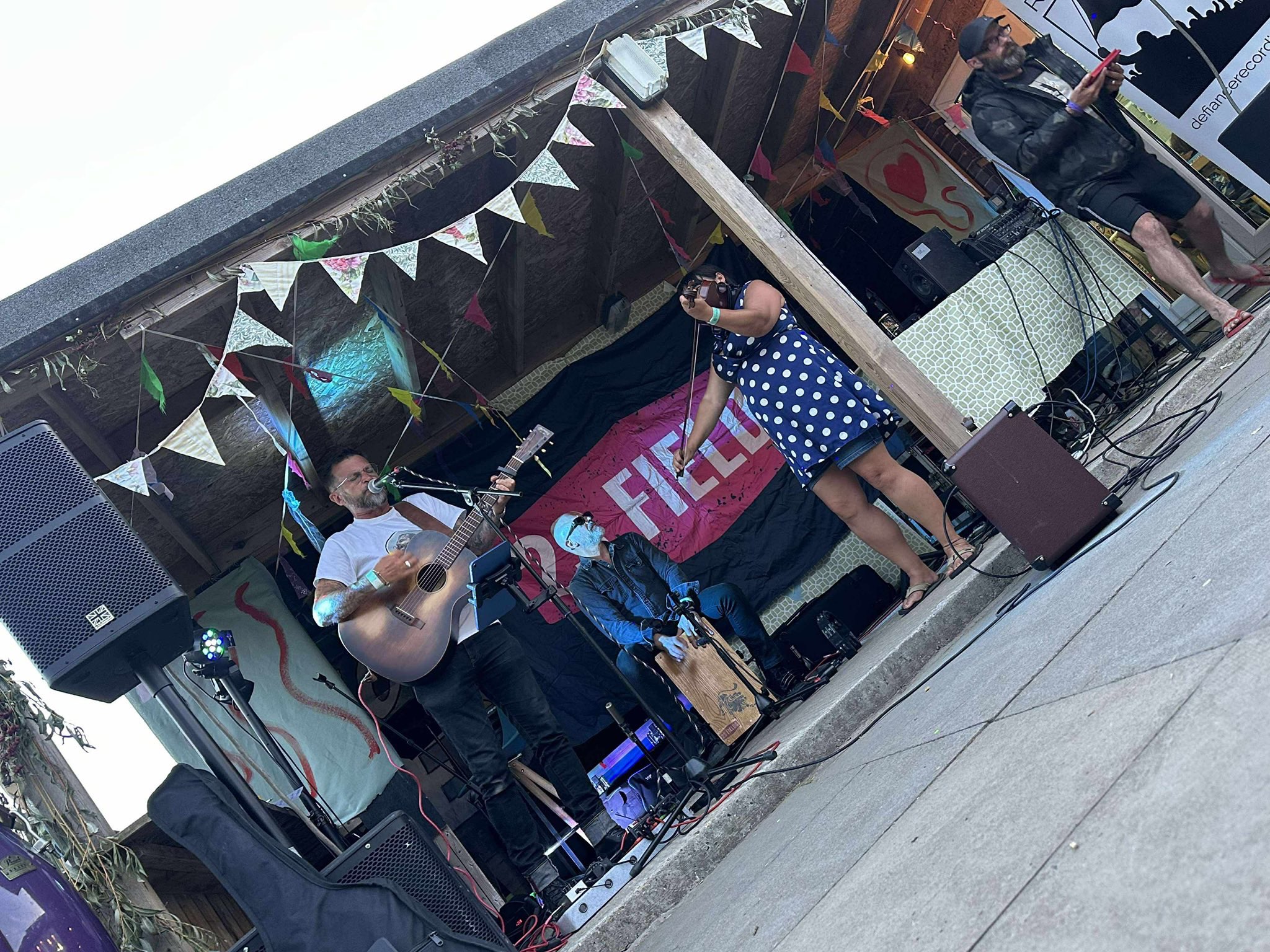 a group of people playing music on a stage