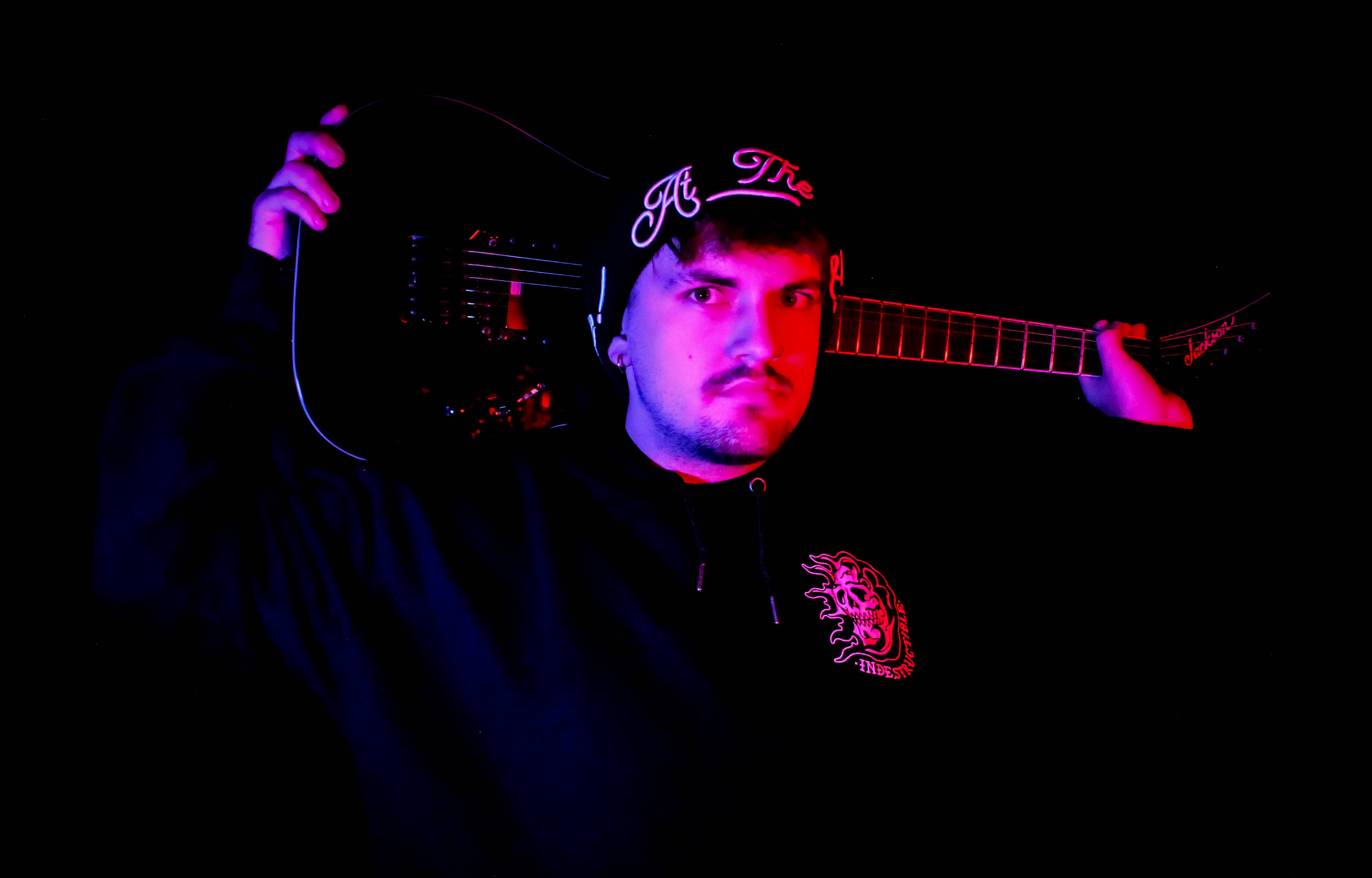 a man holding a guitar