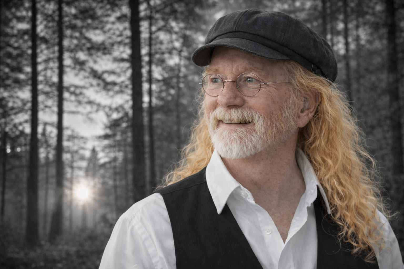 a man wearing a hat and vest in the woods